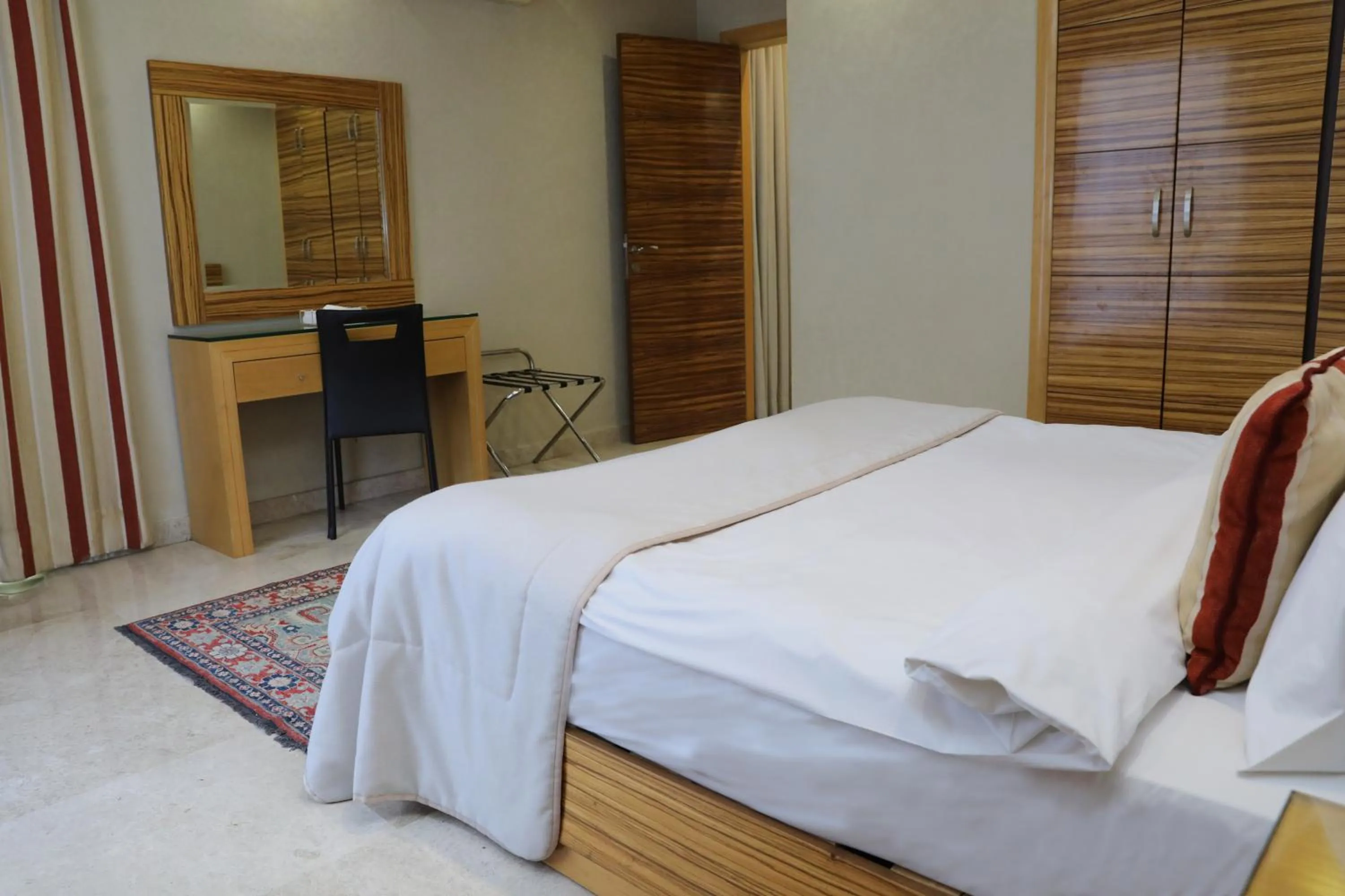 Bed in Imperial Suites Hotel