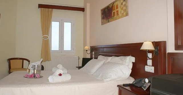 Bed in Venardos Hotel