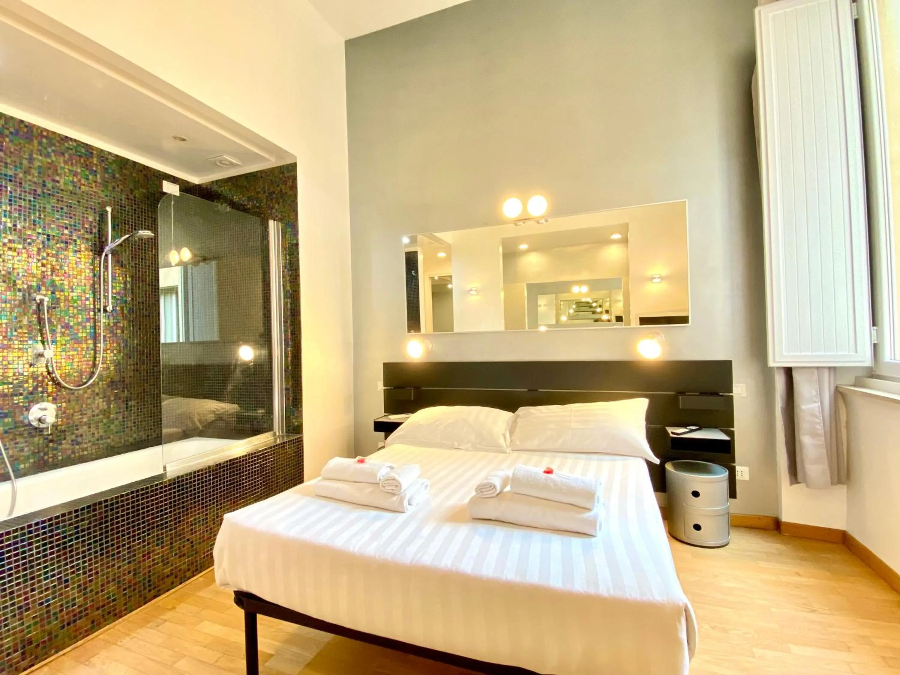 Bed in KISS ME ROME Luxury Rooms