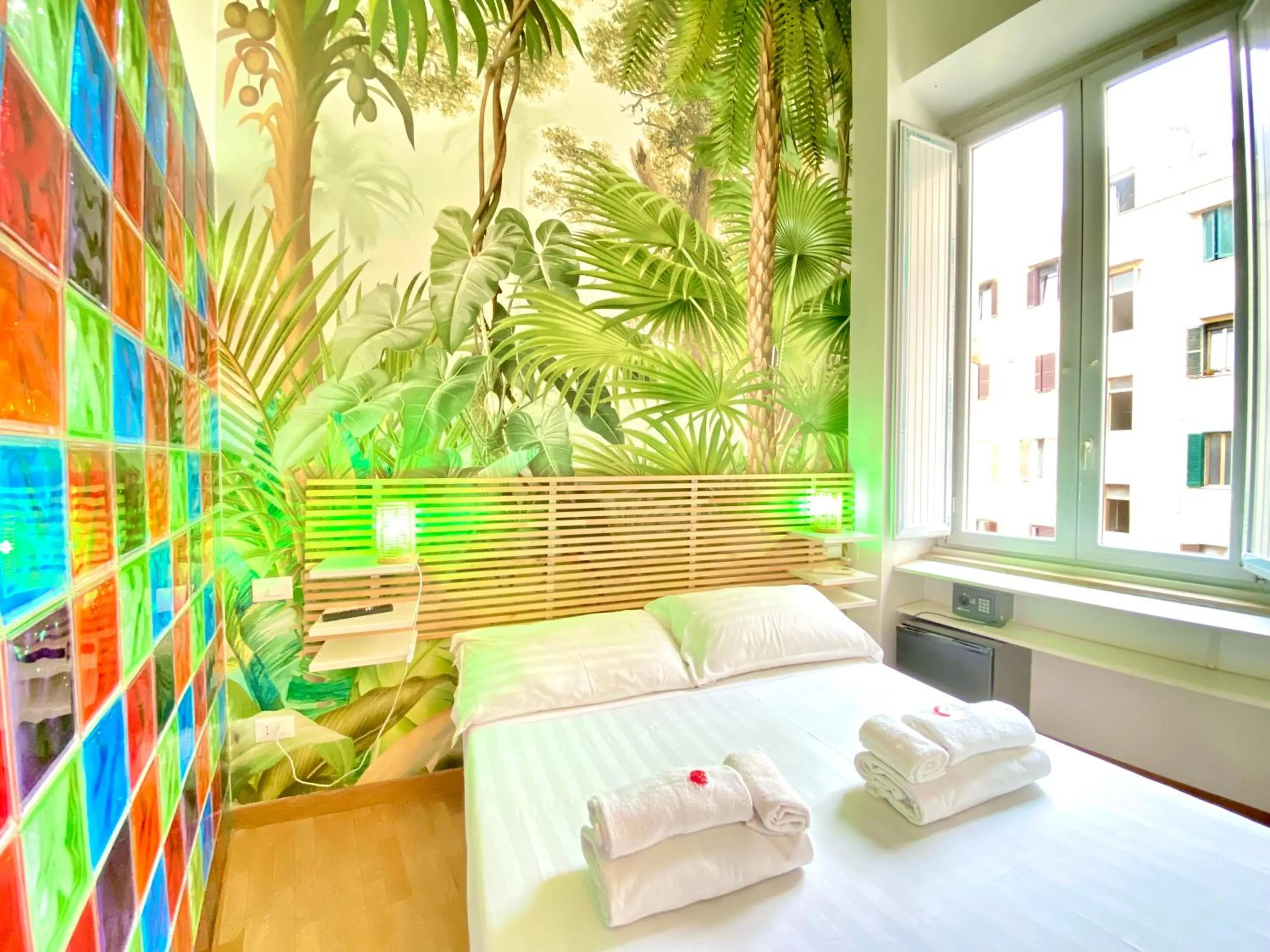 Bed in KISS ME ROME Luxury Rooms