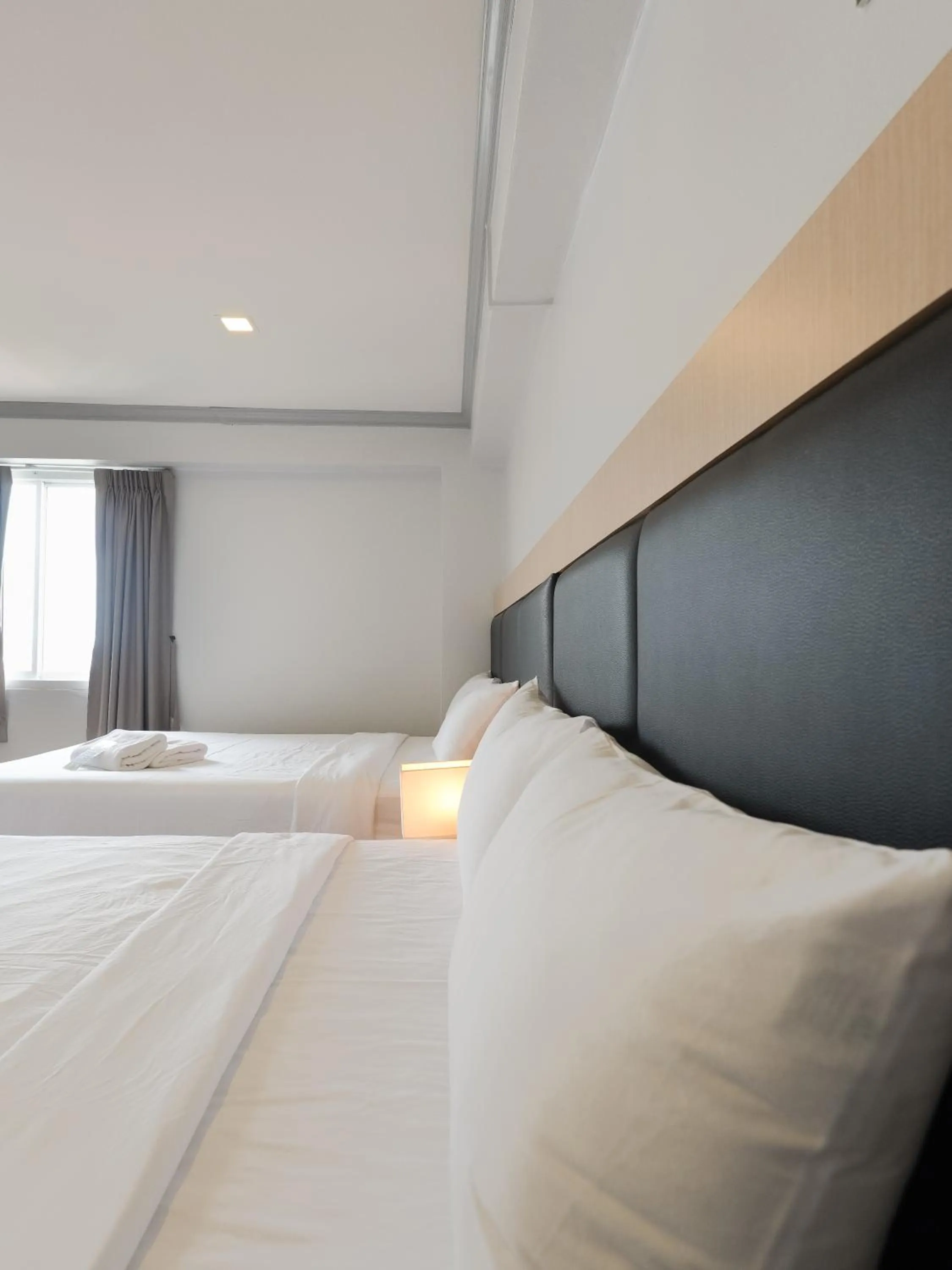 Bed in Regent Ngamwongwan Hotel