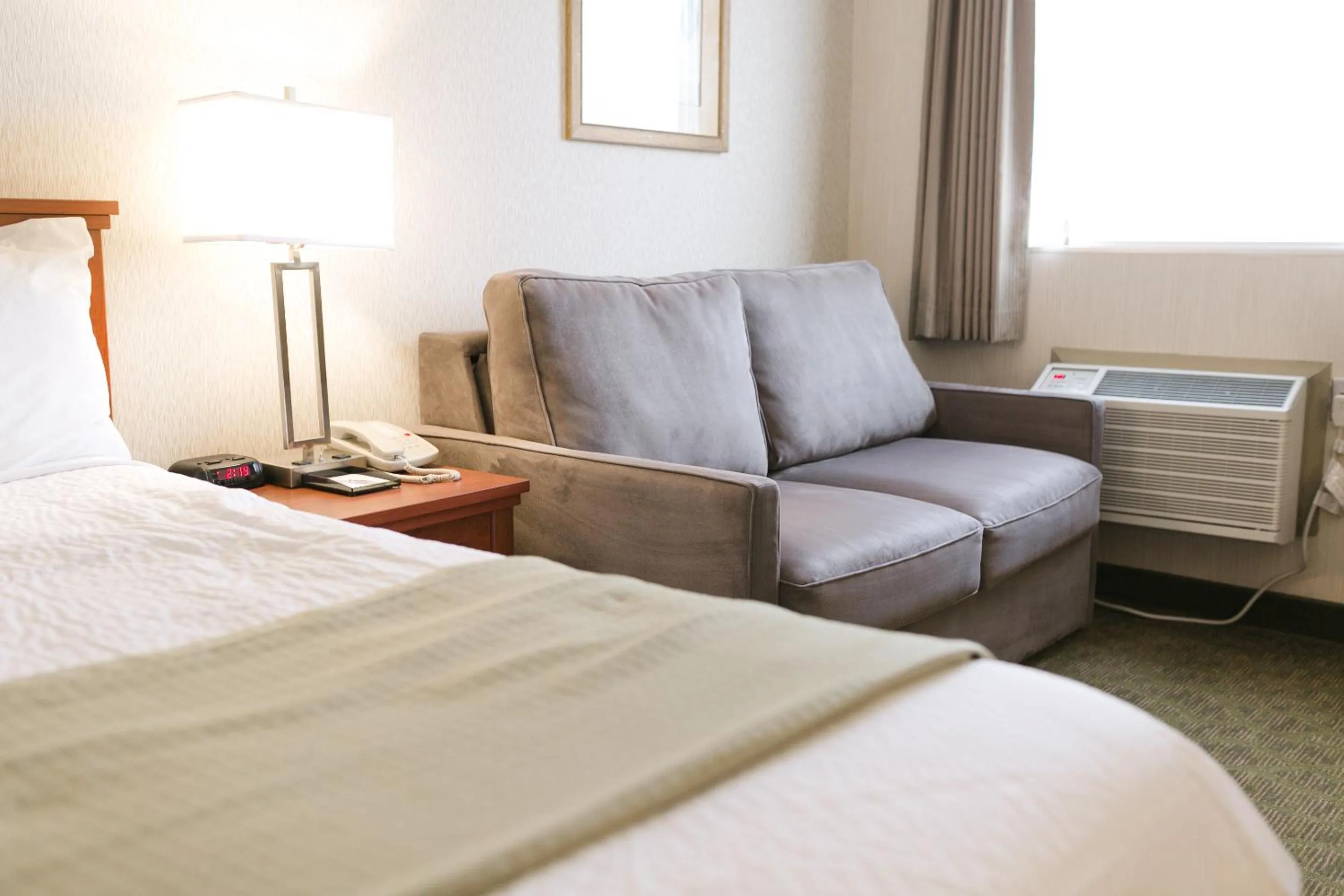 Seating area, Bed in Victoria Inn Flin Flon