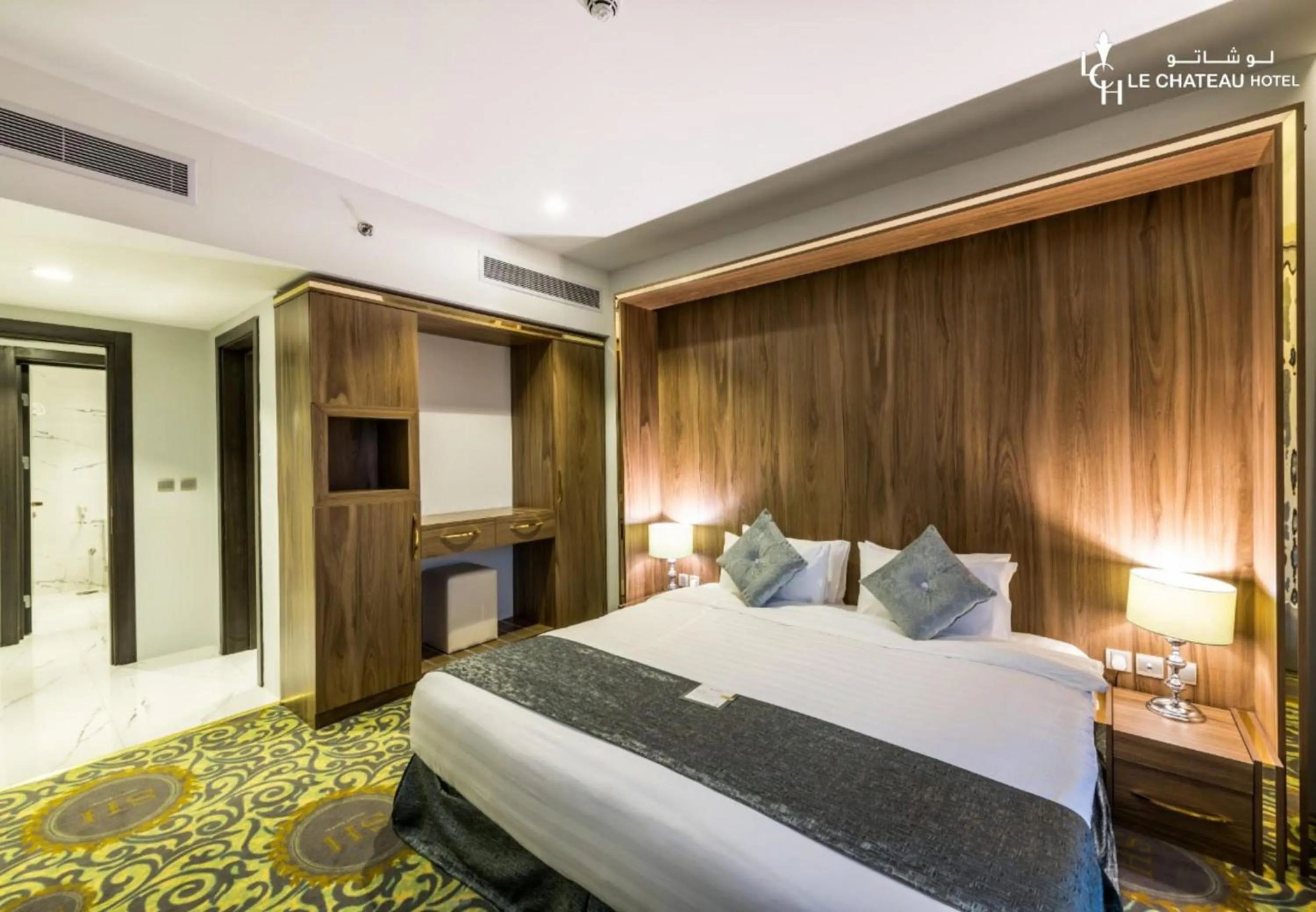 Bed in LeChateau Boutique Hotel