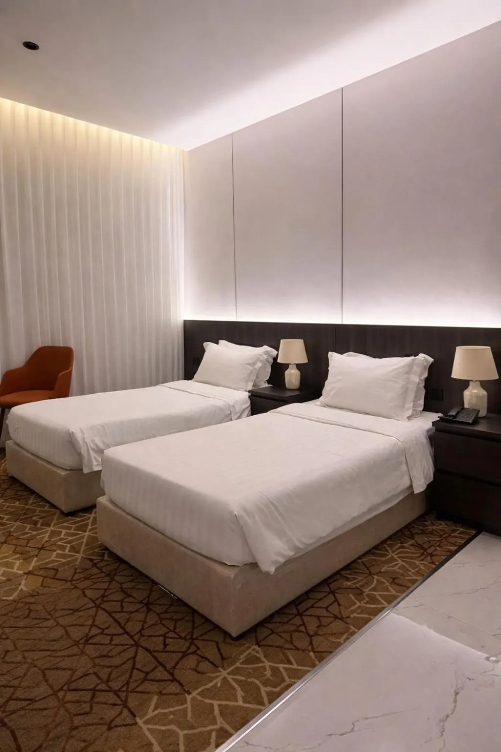 Bed in LeChateau Boutique Hotel