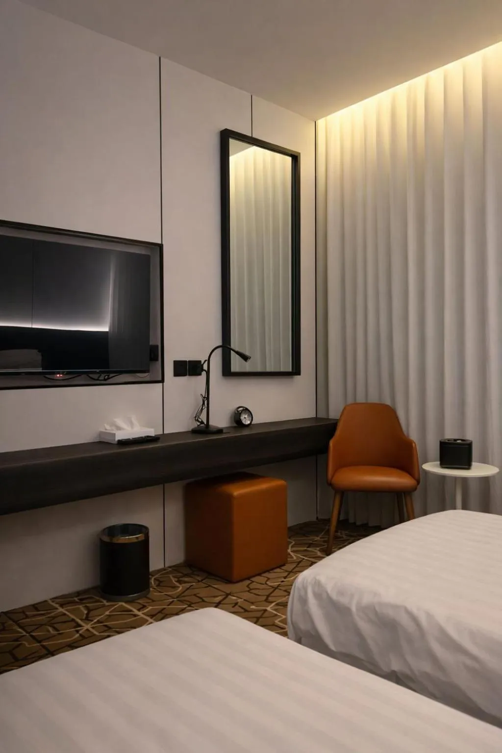 Bed in LeChateau Boutique Hotel