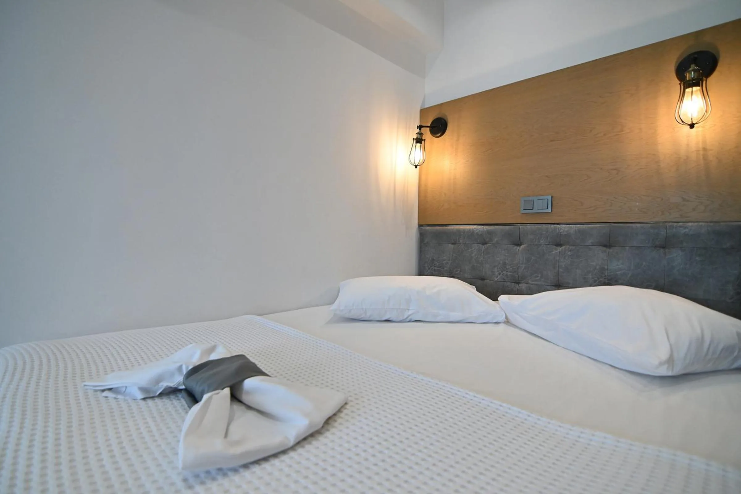 Bed in Amalia Rooms Sea View