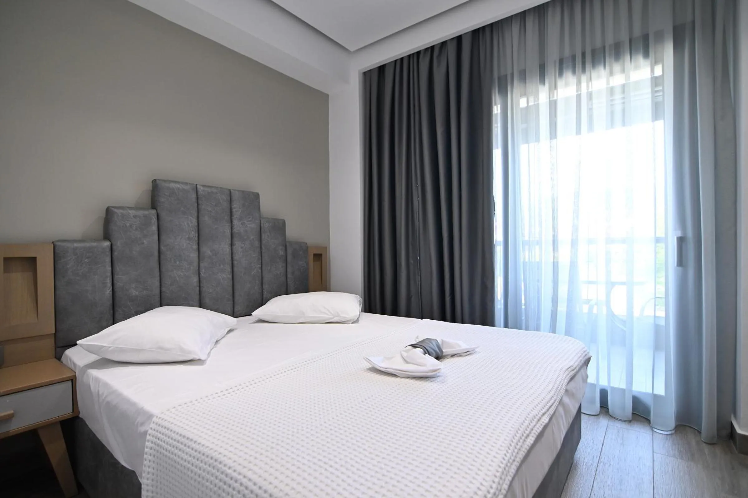 Bed in Amalia Rooms Sea View