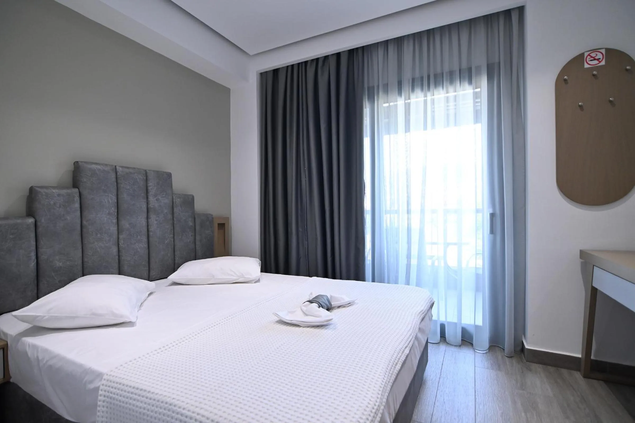 Bed in Amalia Rooms Sea View