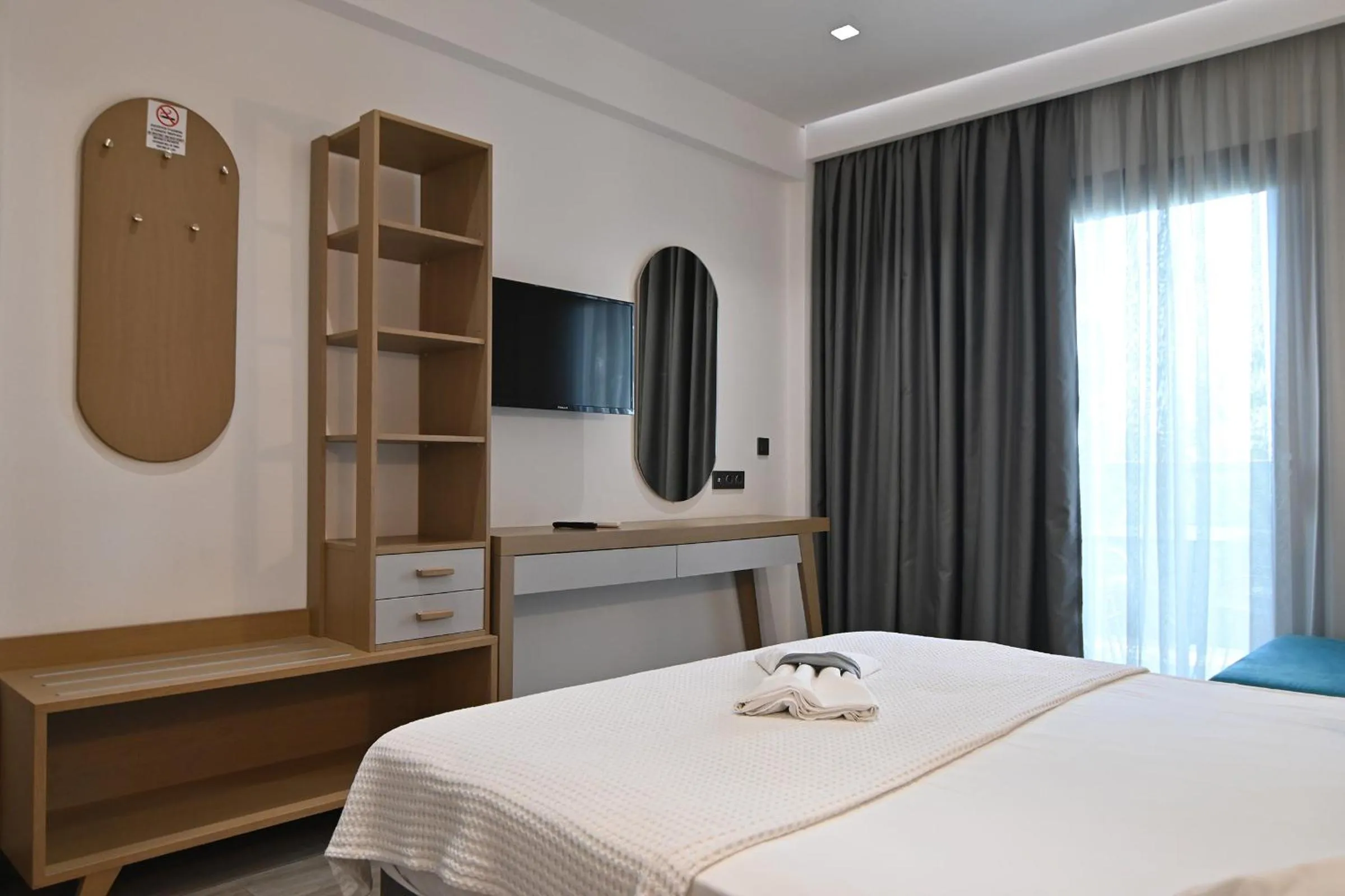 Bed in Amalia Rooms Sea View