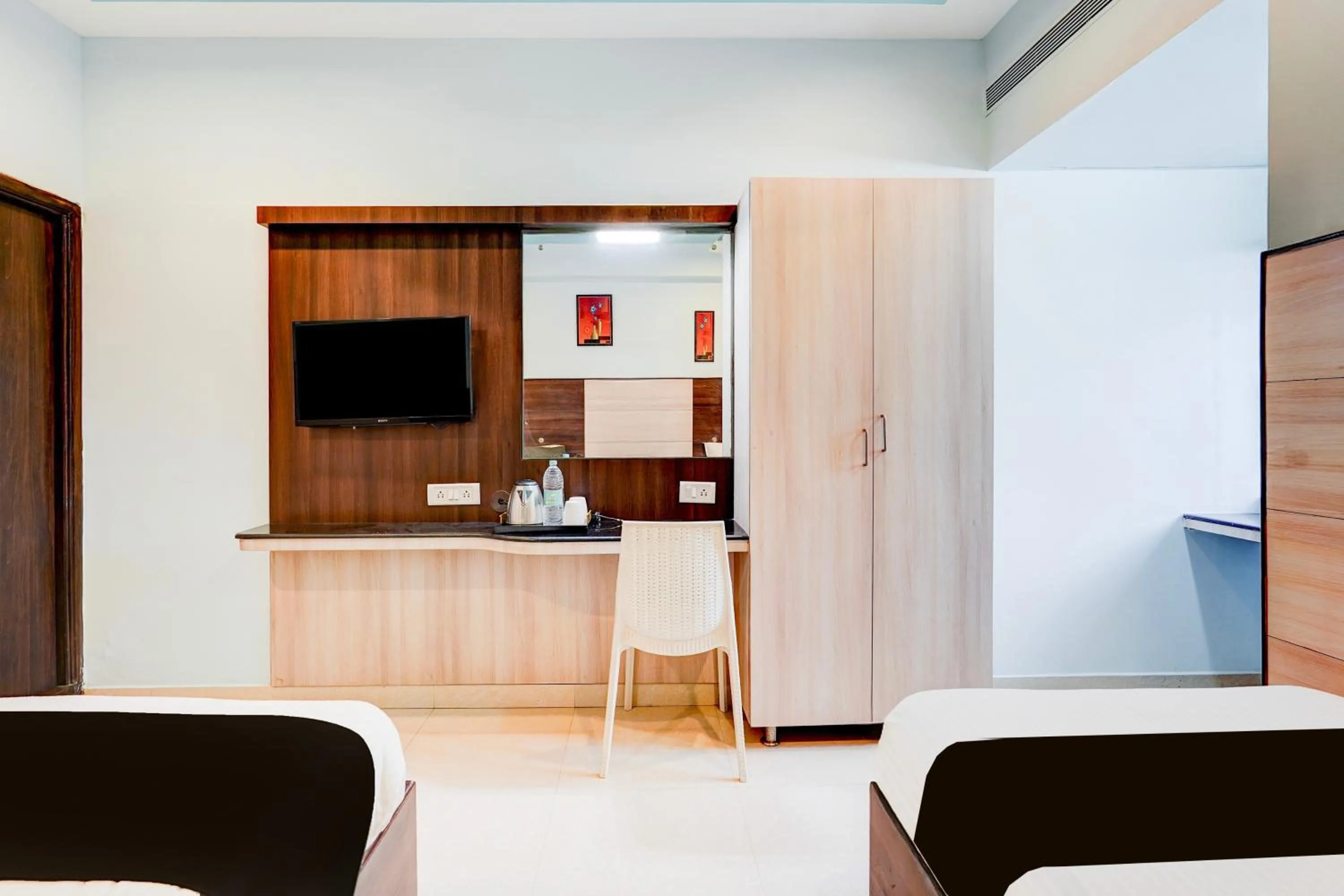 Bedroom in Super Townhouse Chennai Near Airport Formerly Sai Bala Budget