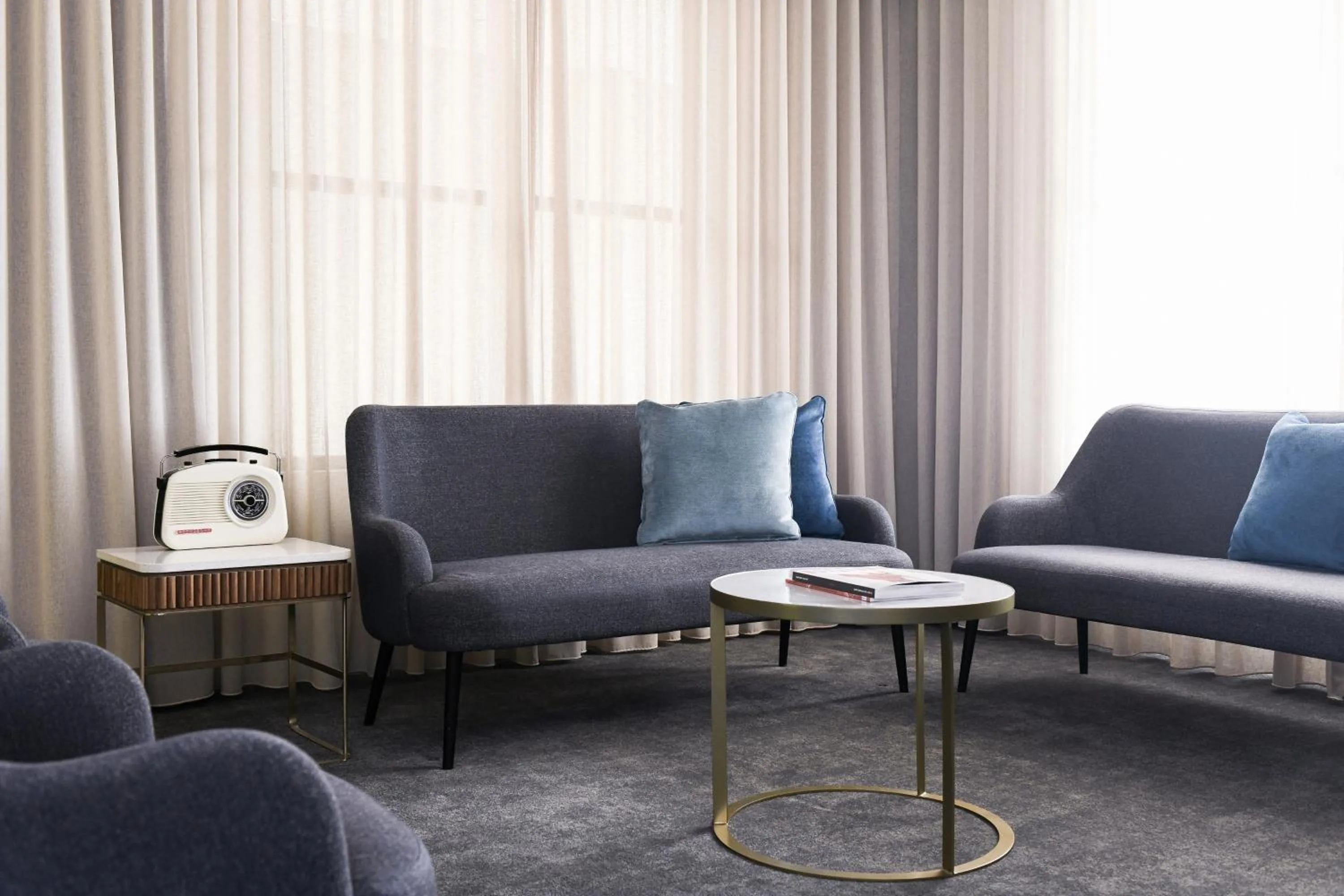 Living room in Powerhouse Hotel Tamworth by Rydges