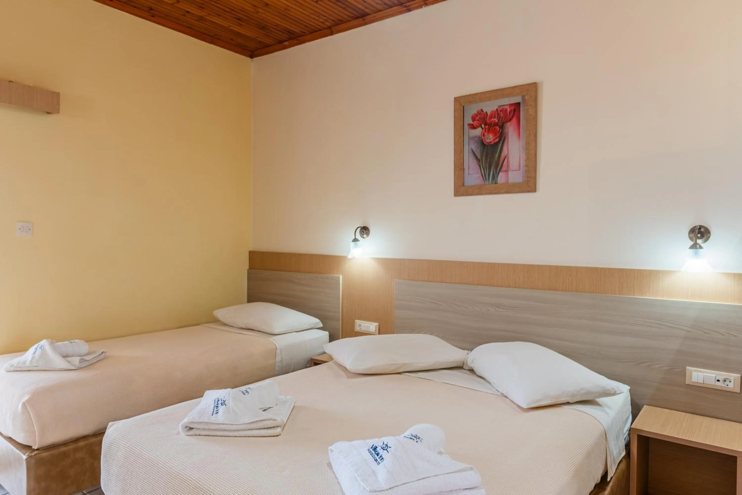 Bed in Village Inn Studios & Family Apartments