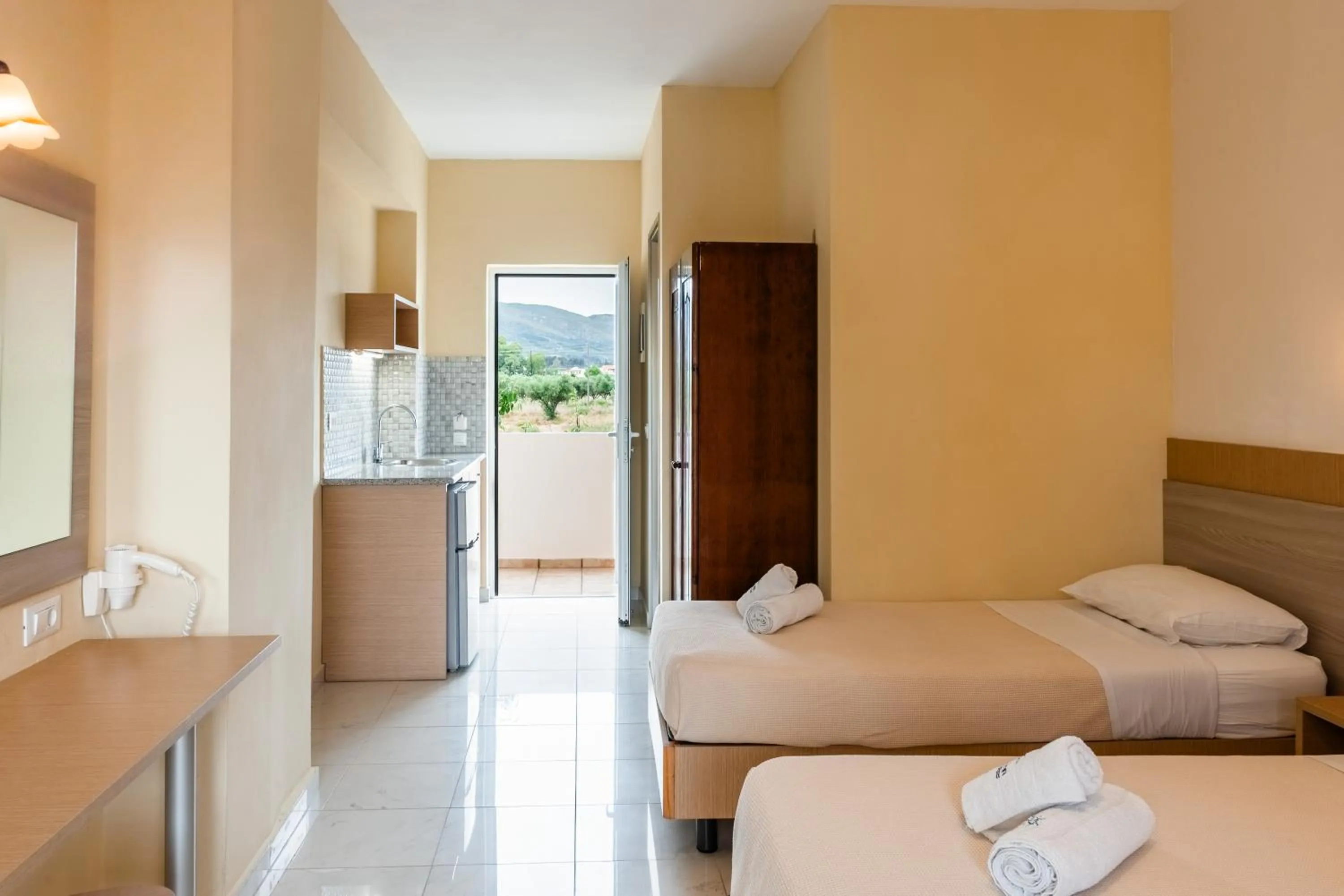 Kitchen or kitchenette, Bed in Village Inn Studios & Family Apartments