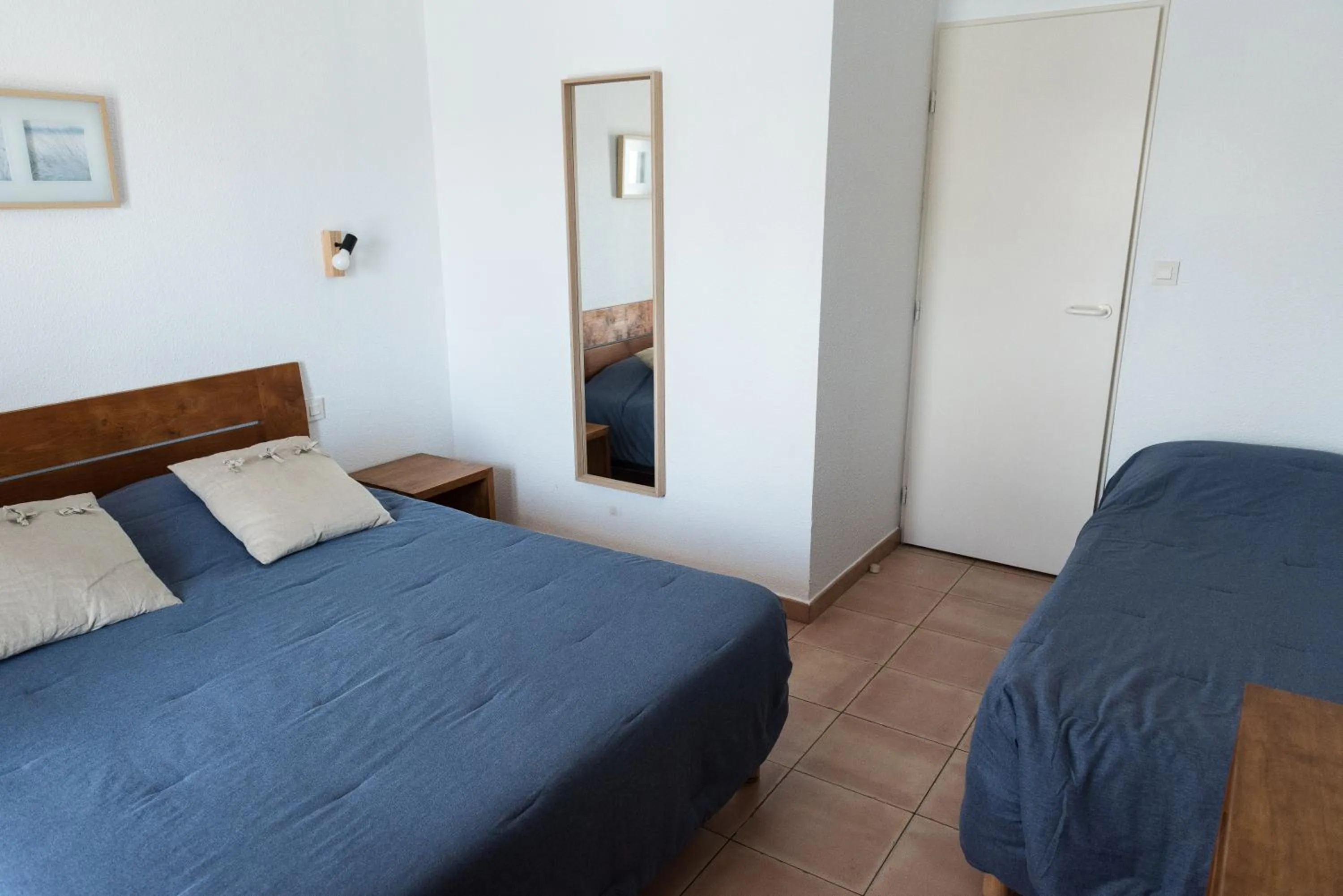 Bed in Hotel Le Bleu Marine