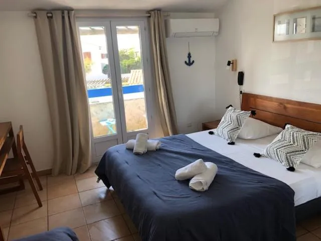 Bed in Hotel Le Bleu Marine