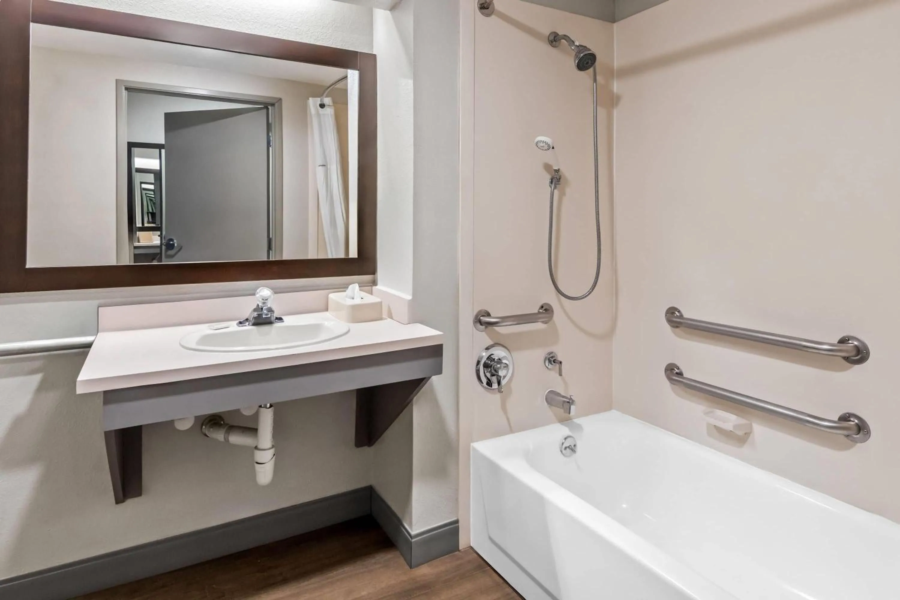 Bathroom in Days Inn & Suites by Wyndham DeSoto