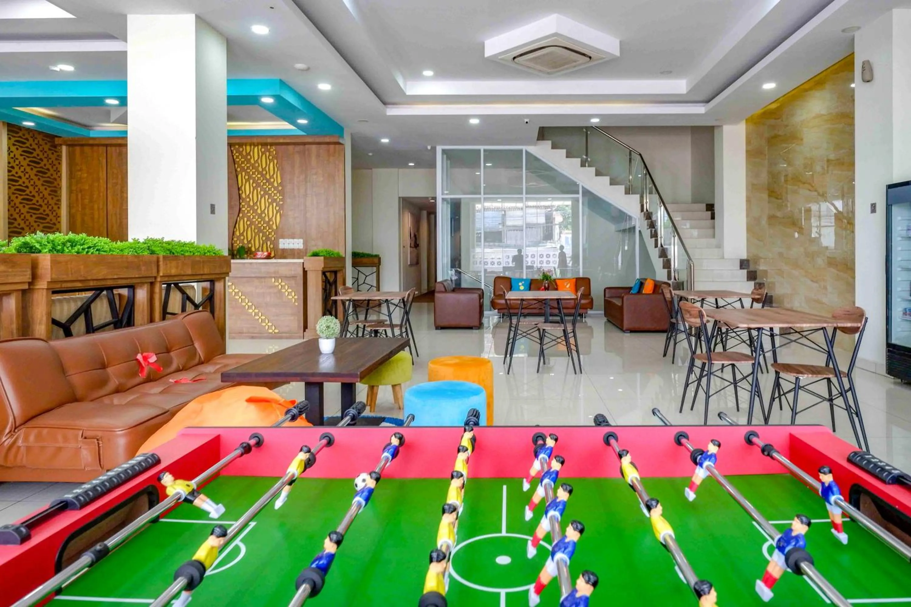 Seating area in Sans Hotel Nagari Malioboro