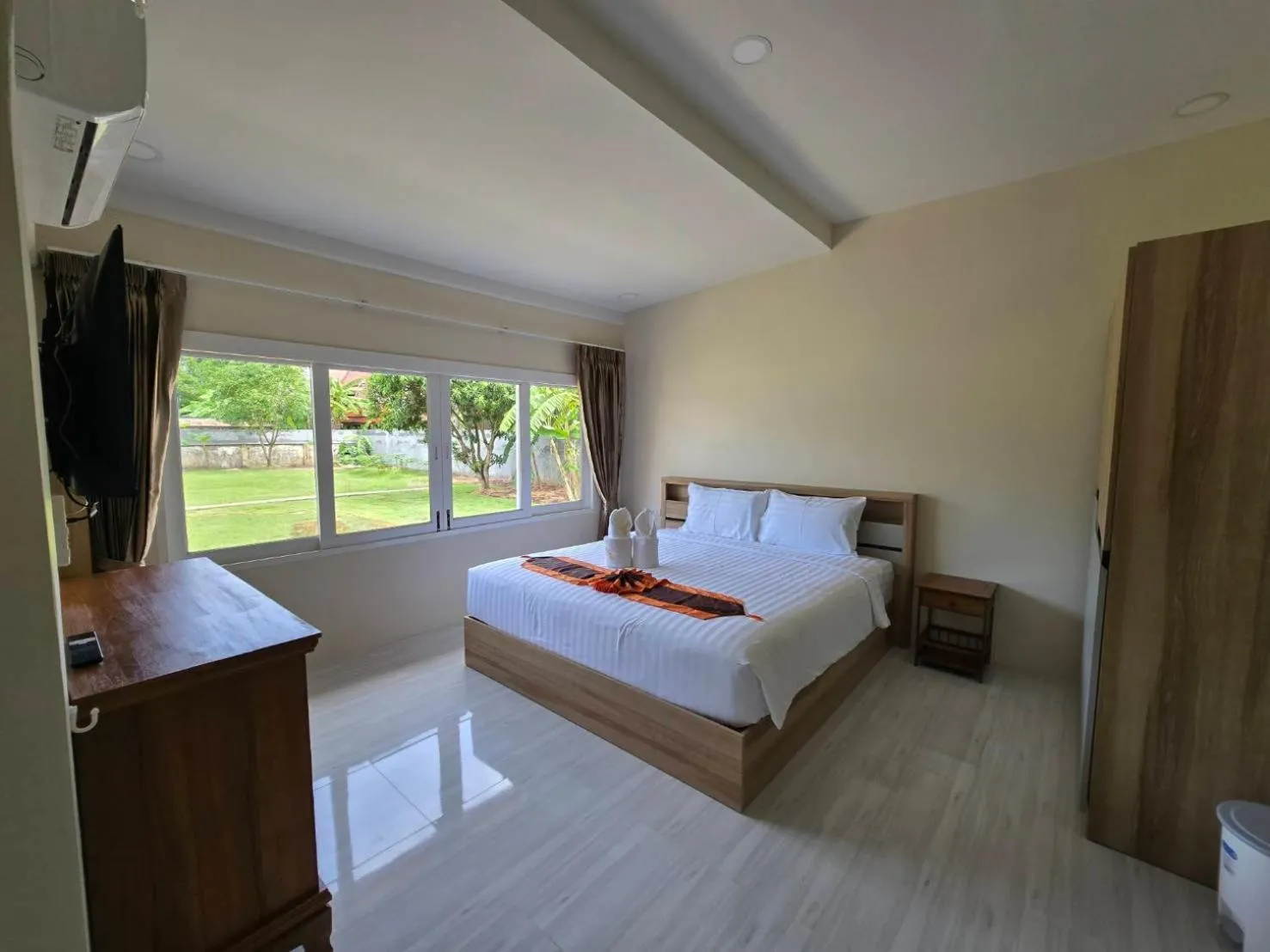 Bed in Natural Samui Hotel