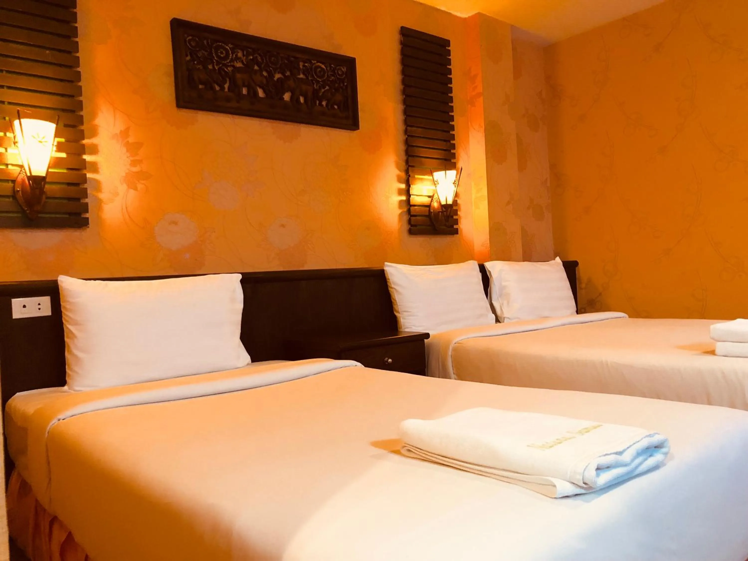 Bed in Natural Samui Hotel