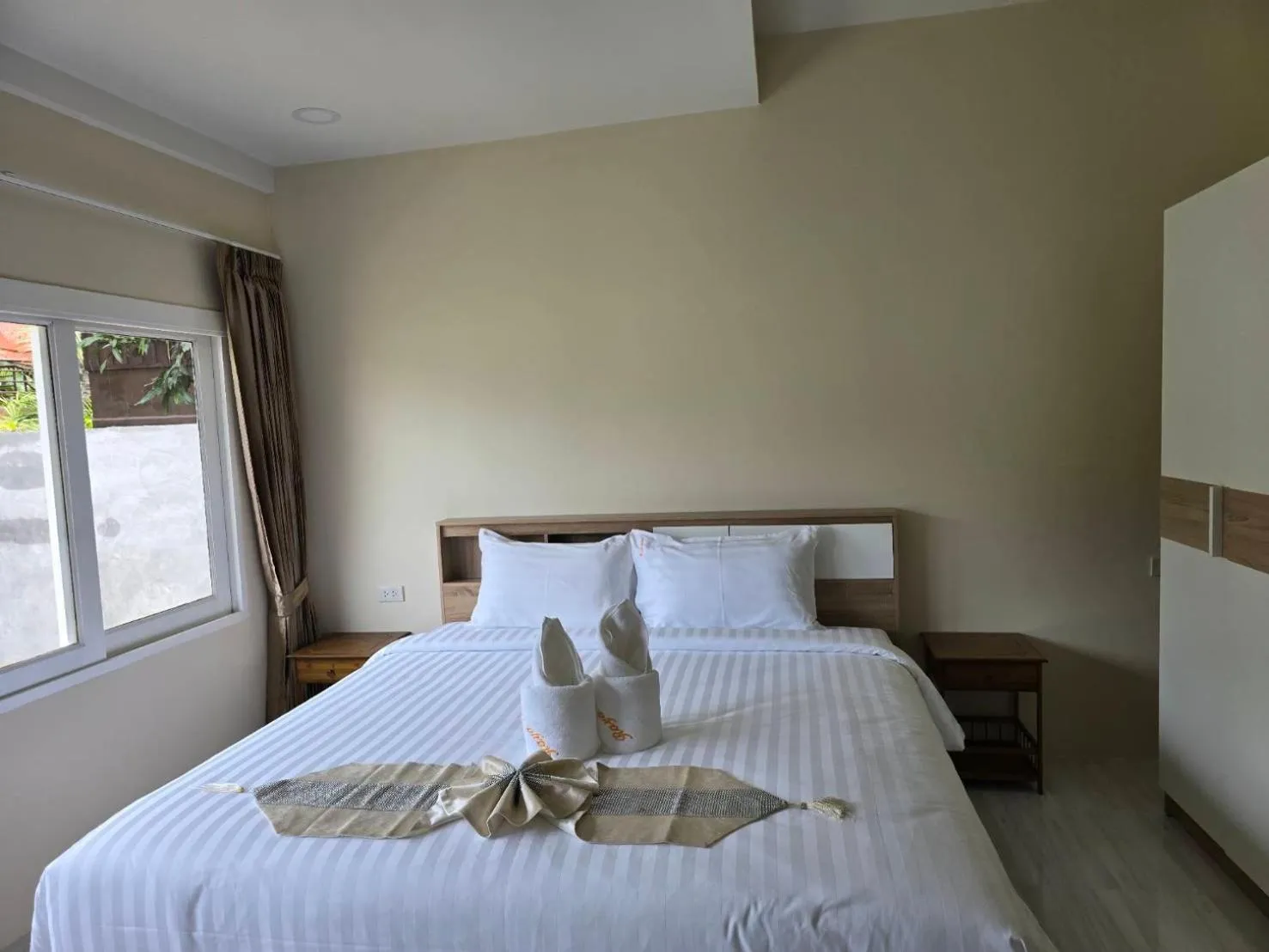 Bed in Natural Samui Hotel