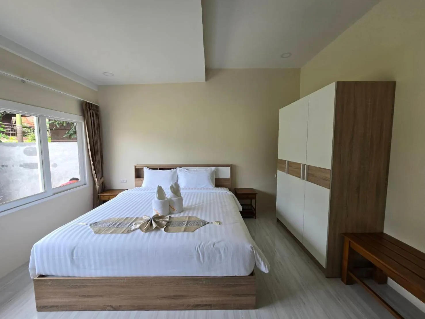 Bed in Natural Samui Hotel