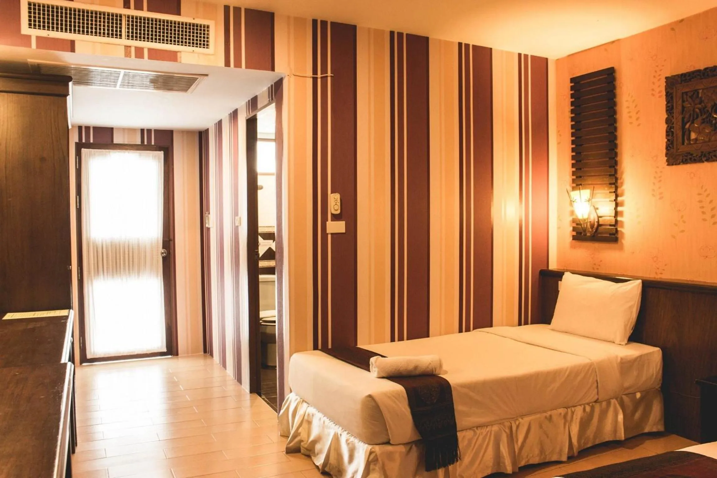 Photo of the whole room, Bed in Natural Samui Hotel