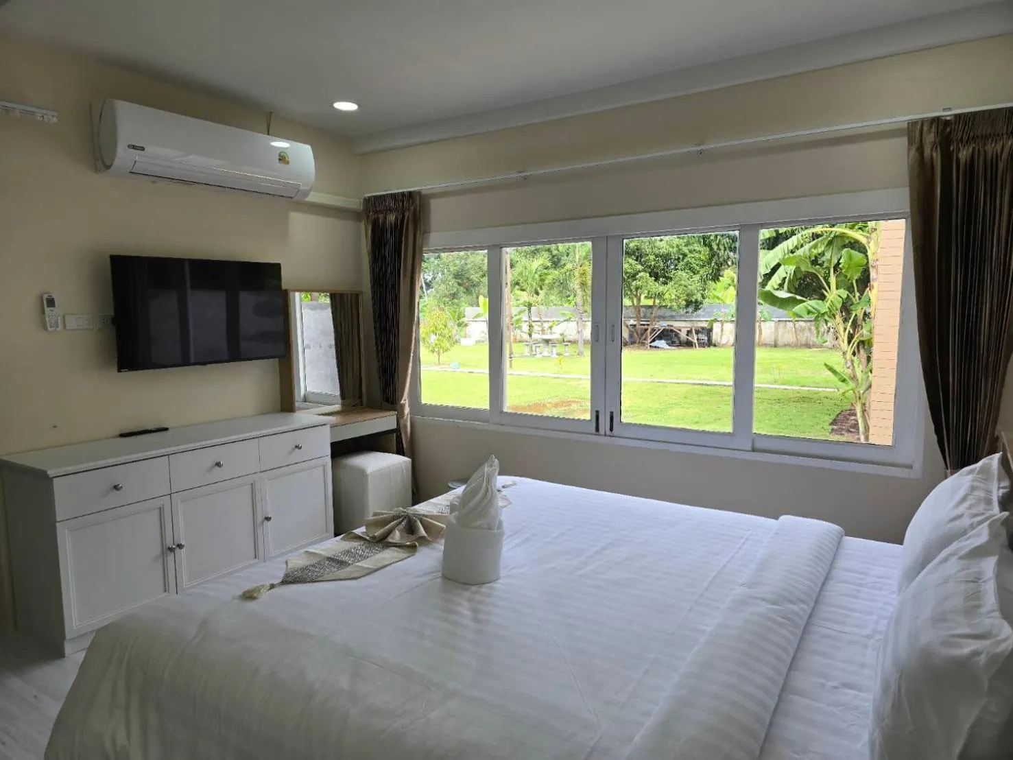 Bed in Natural Samui Hotel