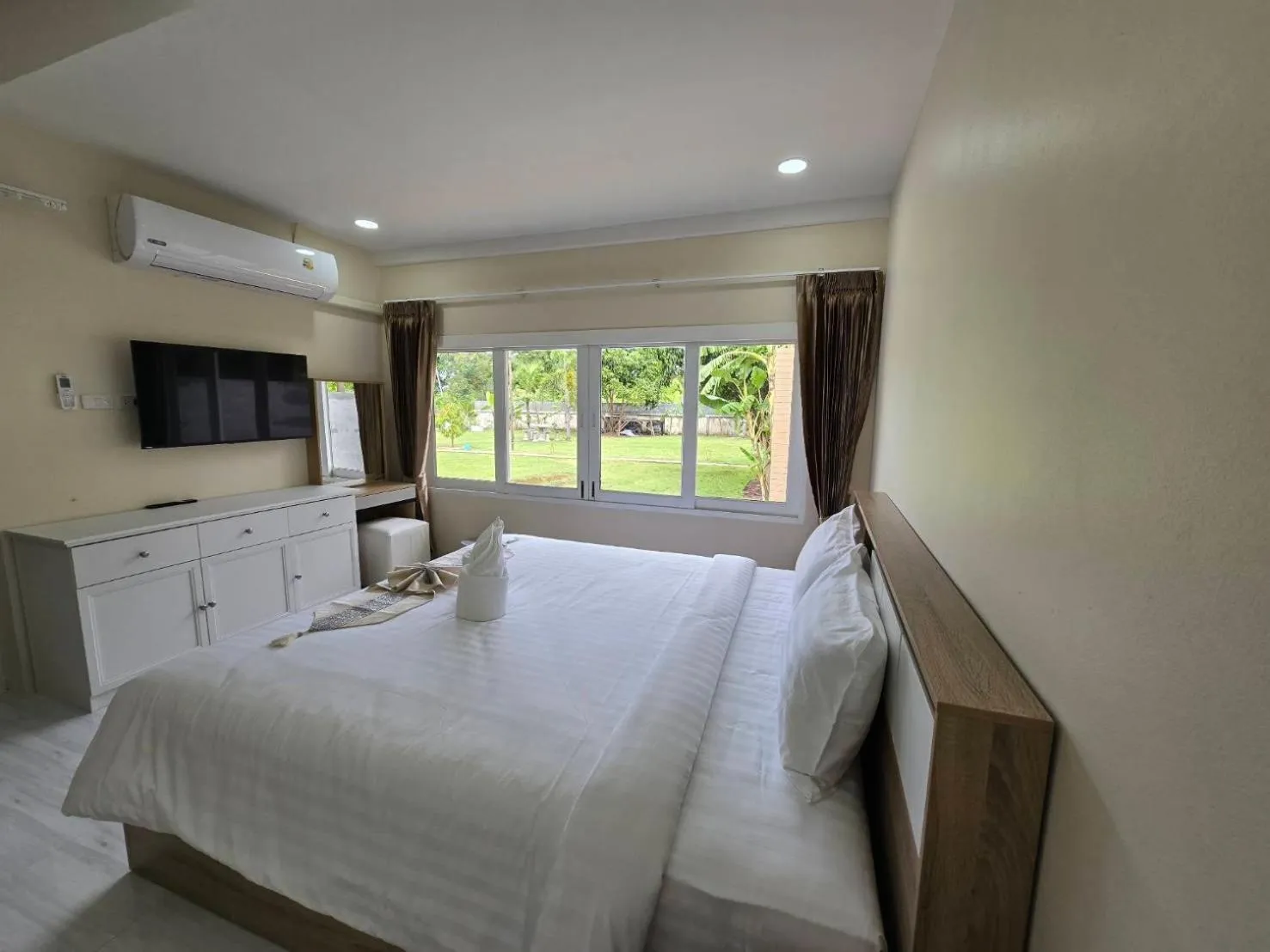 Bed in Natural Samui Hotel