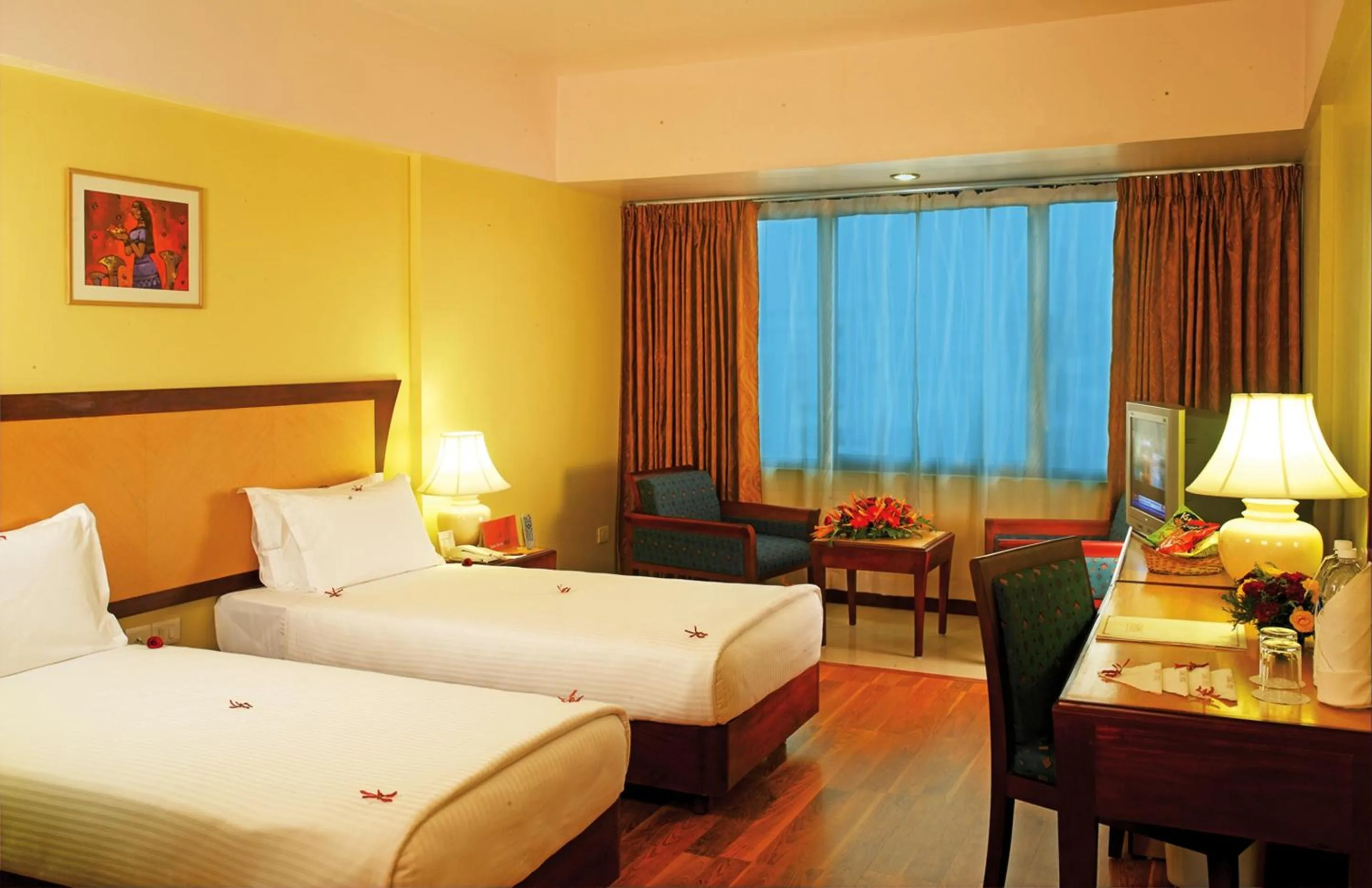 Photo of the whole room, Bed in Classic Sarovar Portico Trivandrum