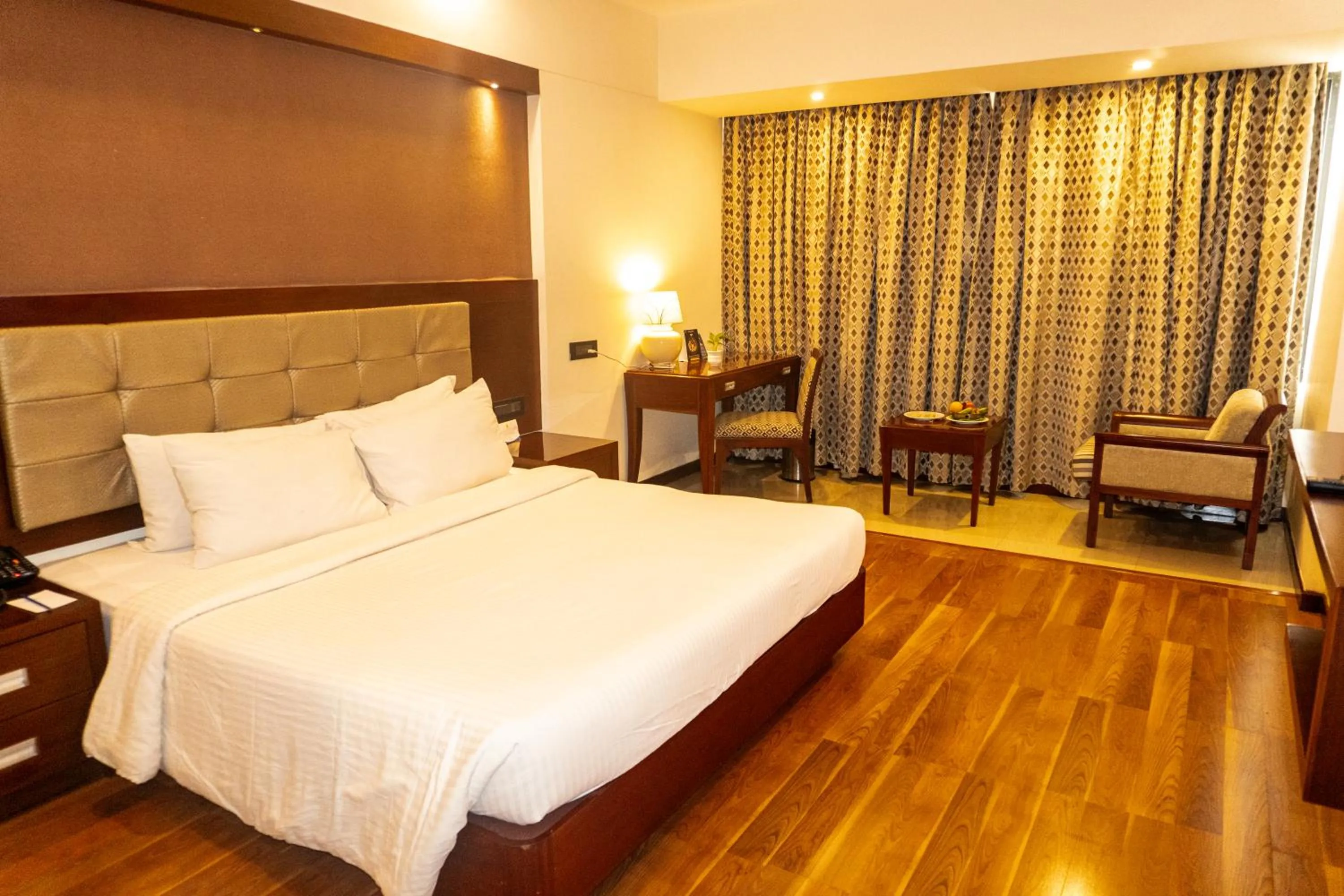 Photo of the whole room, Bed in Classic Sarovar Portico Trivandrum