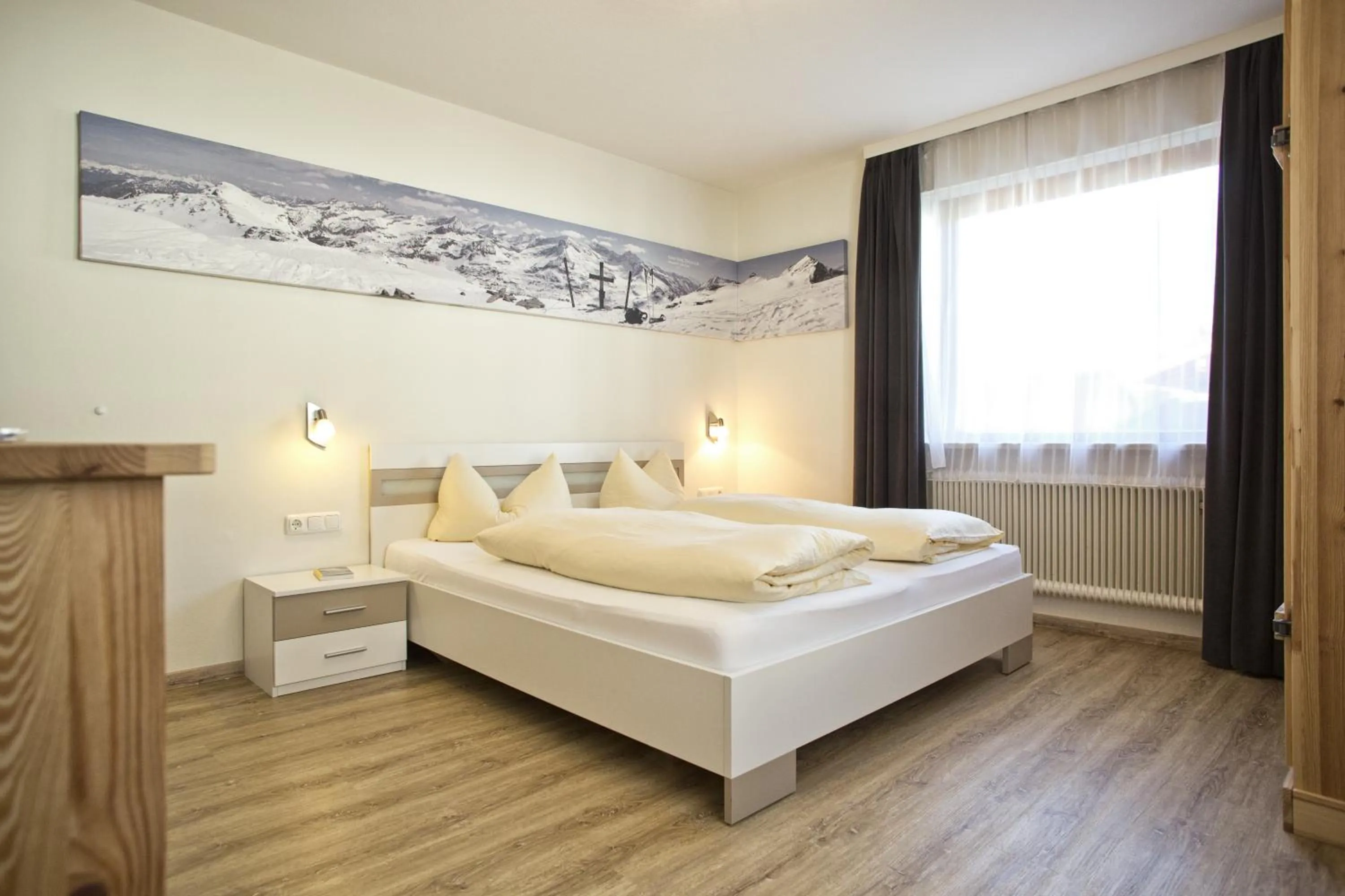 Photo of the whole room, Bed in Alphotel Mittersill