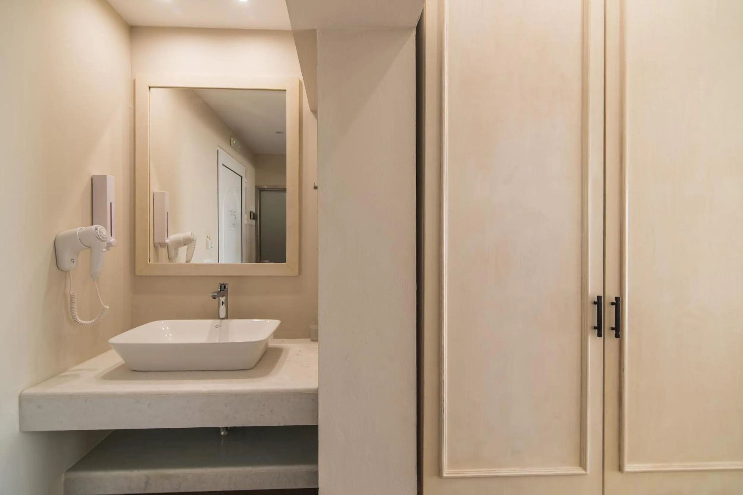 Bathroom in Belussi Beach Hotel & Suites