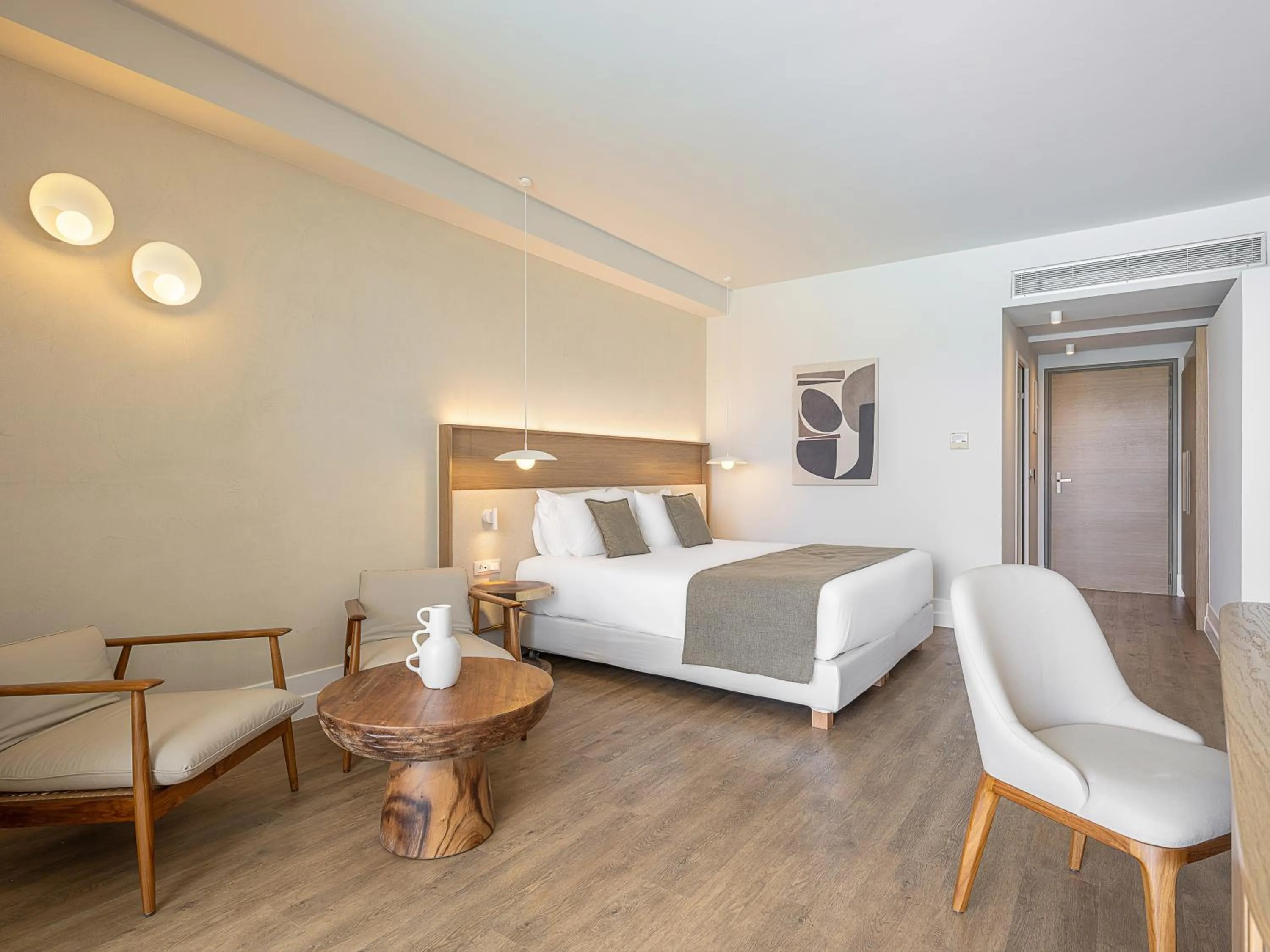 Seating area, Bed in Avra Imperial Hotel