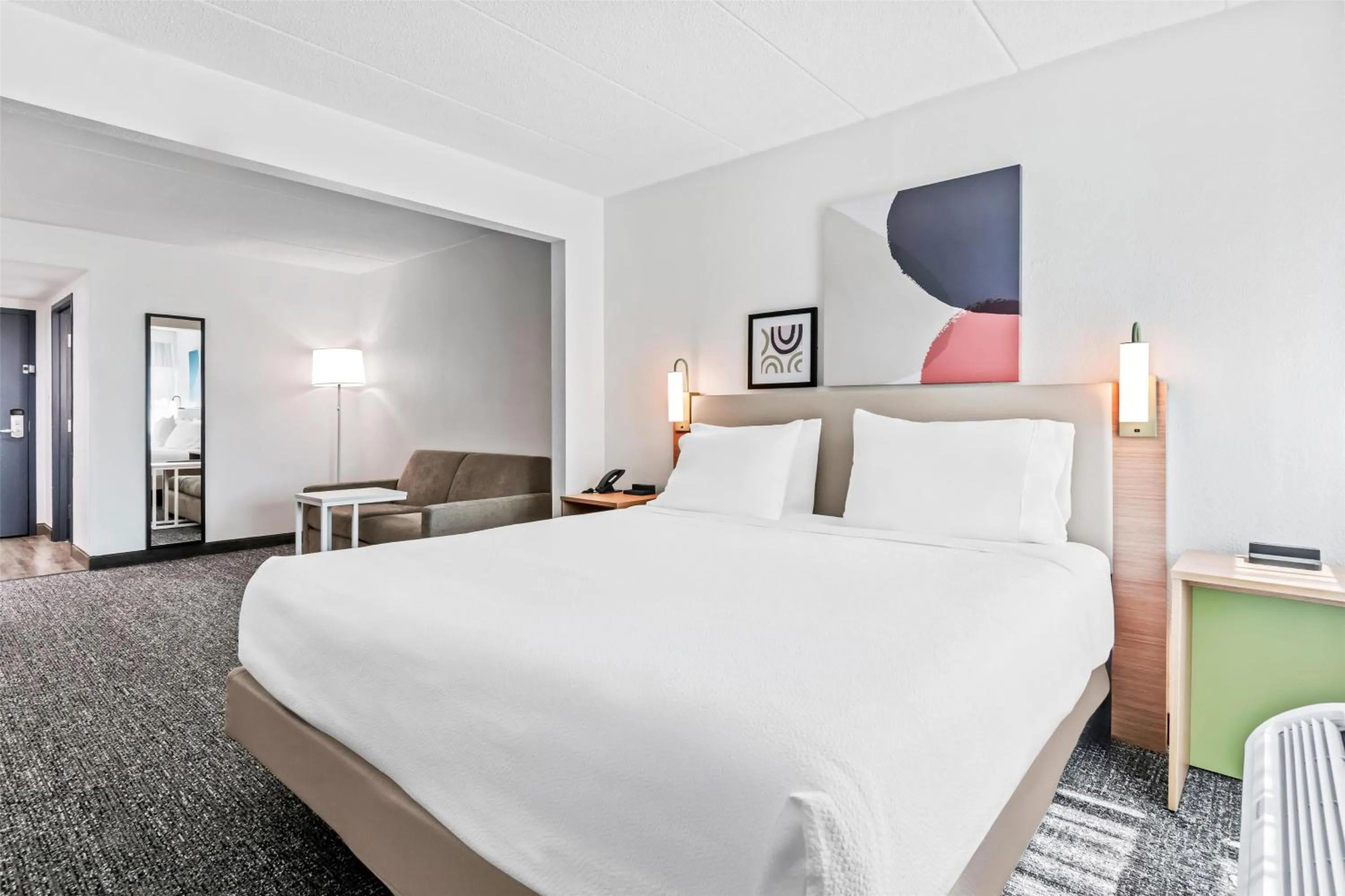 Living room, Bed in Spark by Hilton Mechanicsburg