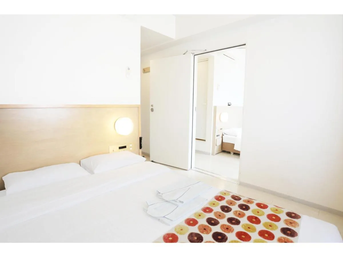 Photo of the whole room, Bed in Smile Hotel Okinawa Naha (Tomari Port)