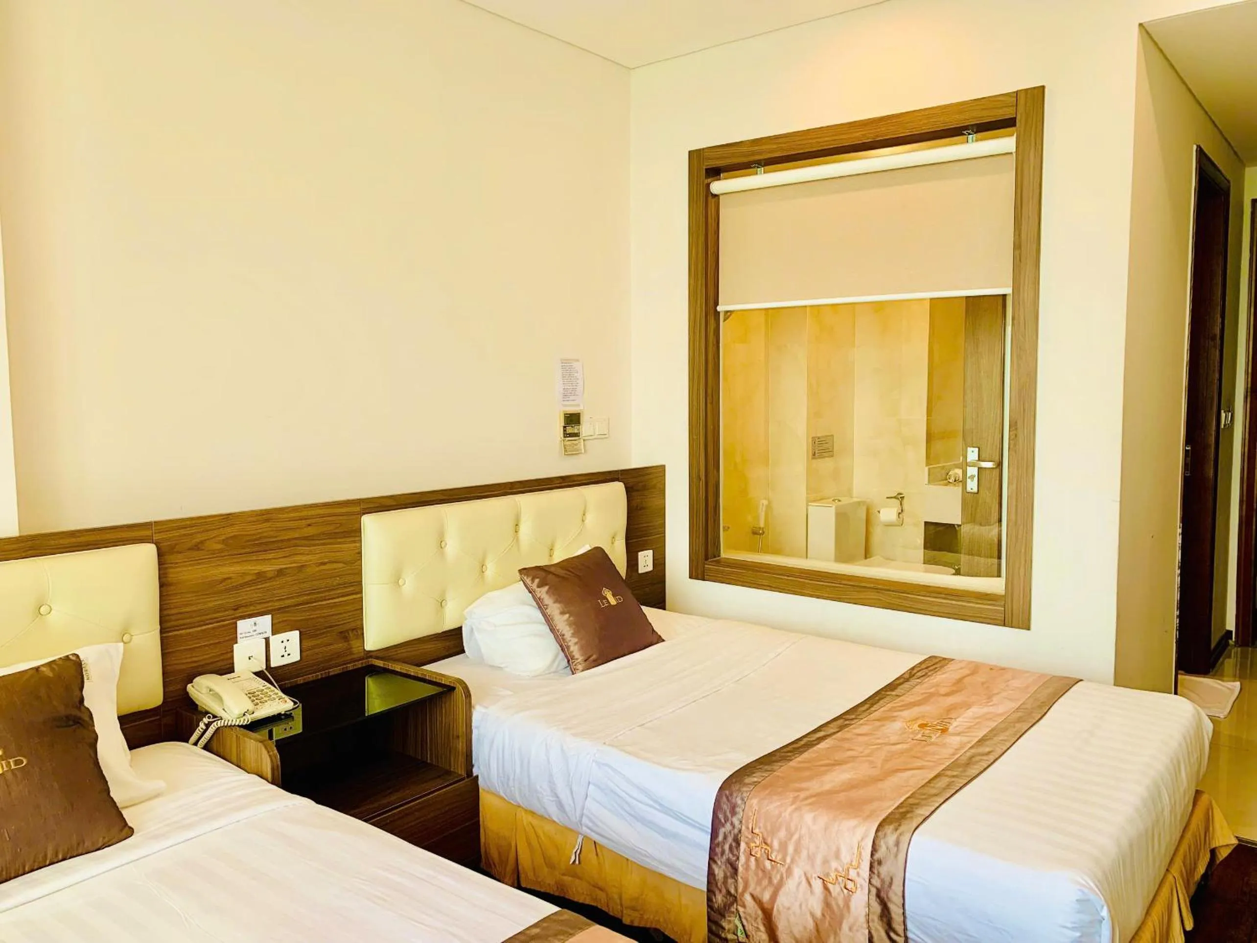 Bed in Lenid Ocean View Hotel