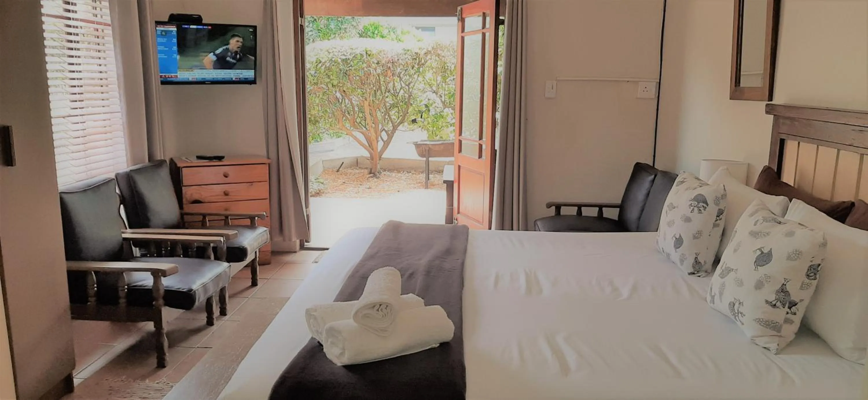 Seating area, Bed in Tourist Lodge Gansbaai