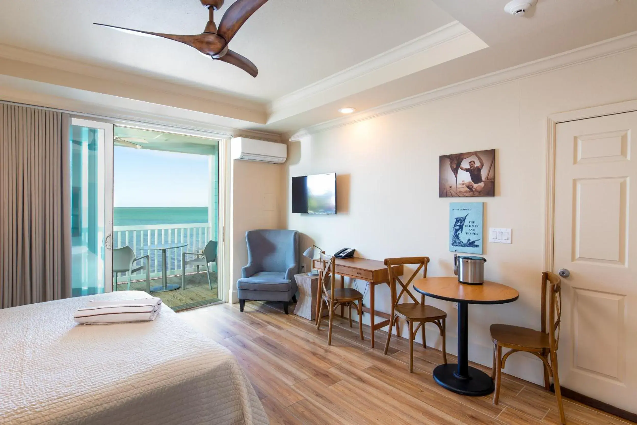 Premium Waterfront Room with King Bed & Private Covered Porch/Balcony in Lime Tree Bay Resort Premium Waterfront Room with King Bed & Private Covered Porch/Balcony in Lime Tree Bay Resort
