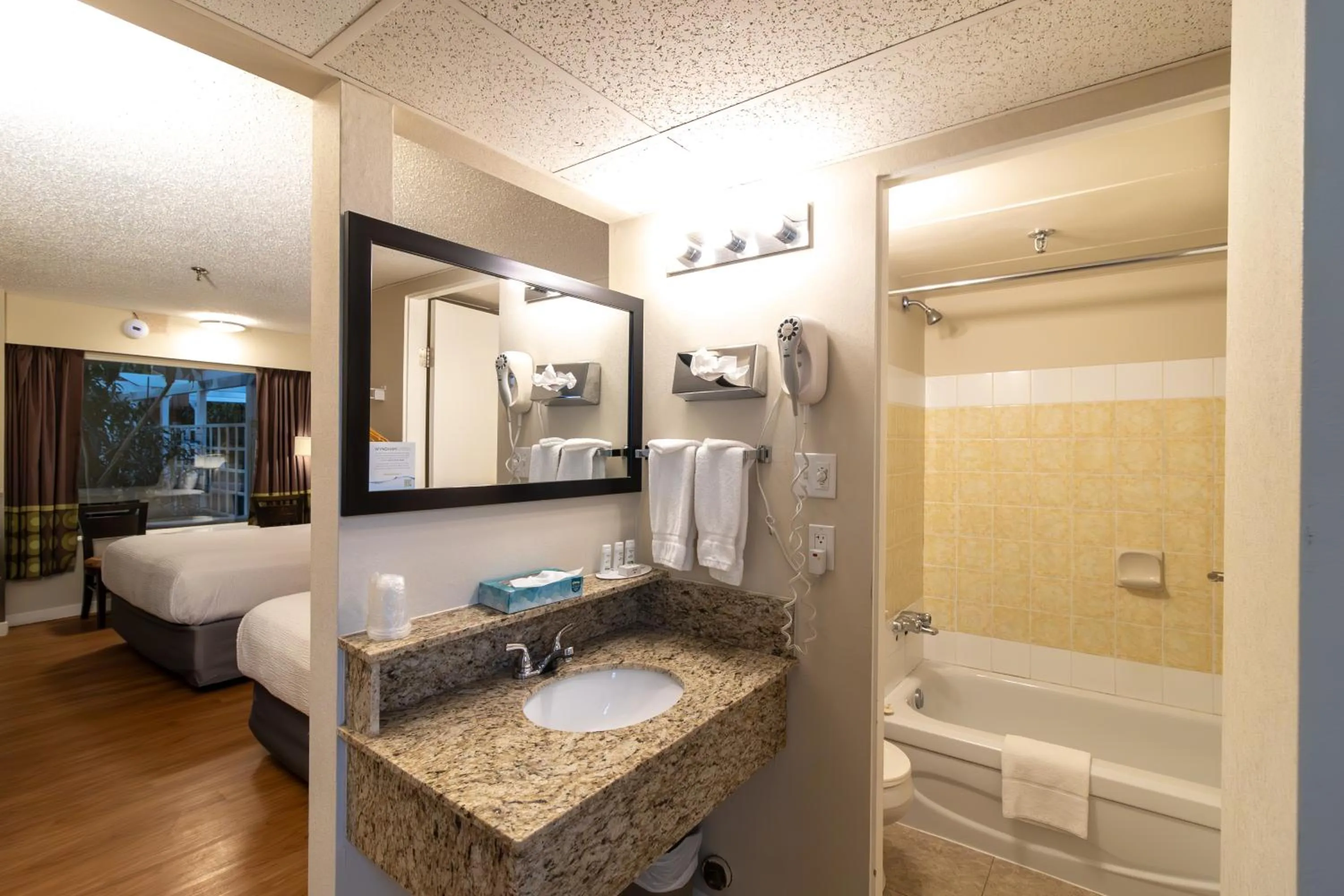 Bathroom, Bed in Super 8 by Wyndham Prince George