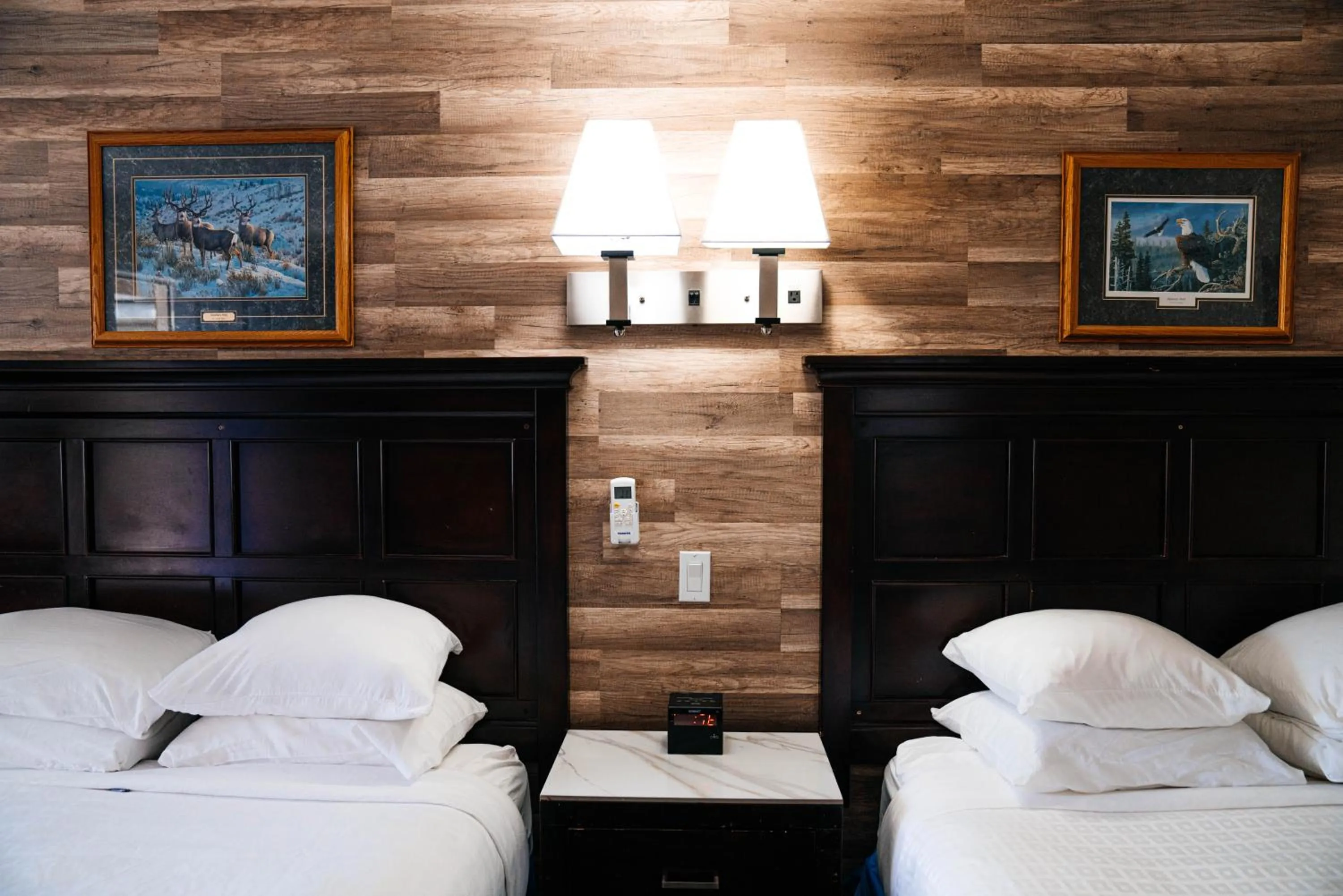 Bed in Salida Inn & Monarch Suites