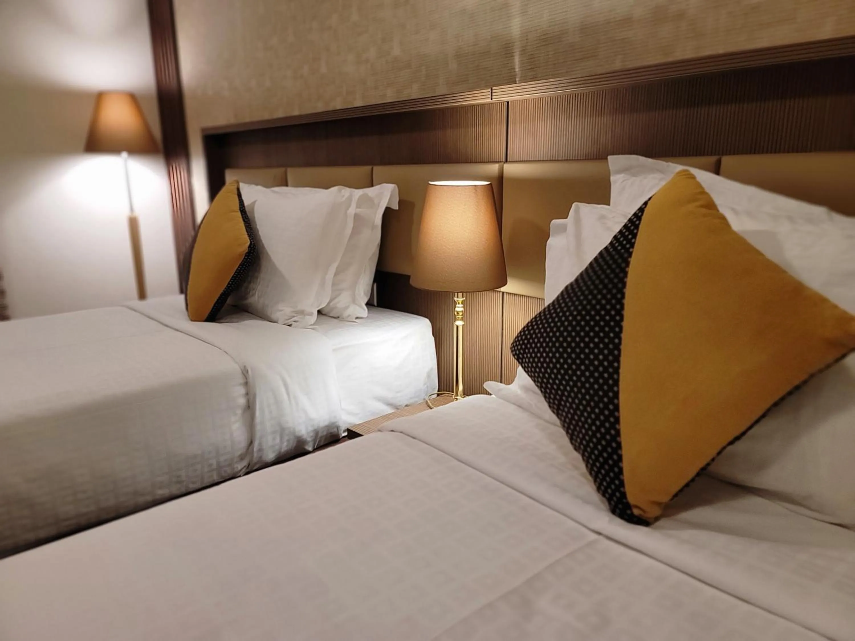 Bed in Al Ansar Palace Golden Tulip Hotel