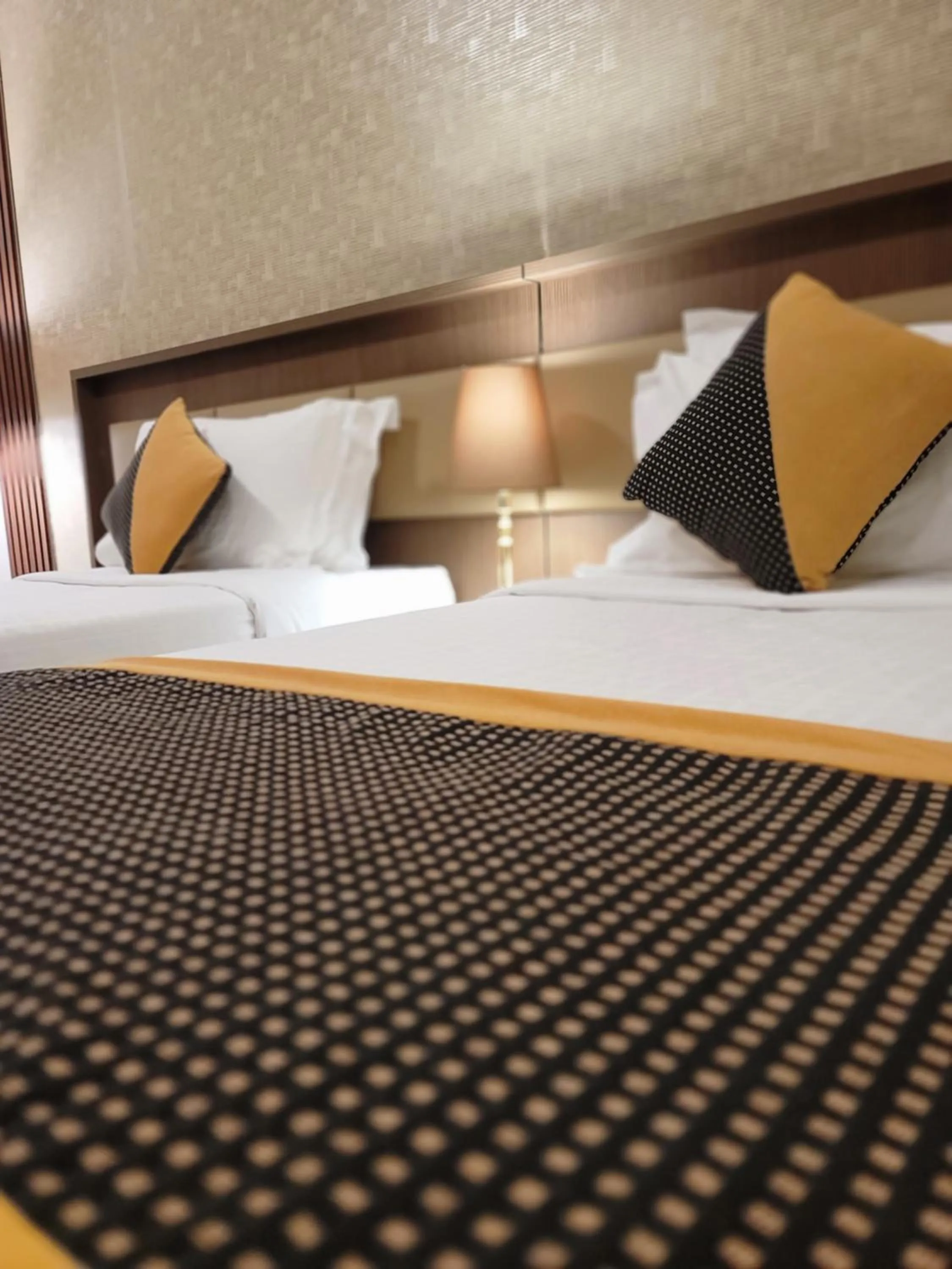 Bed in Al Ansar Palace Golden Tulip Hotel