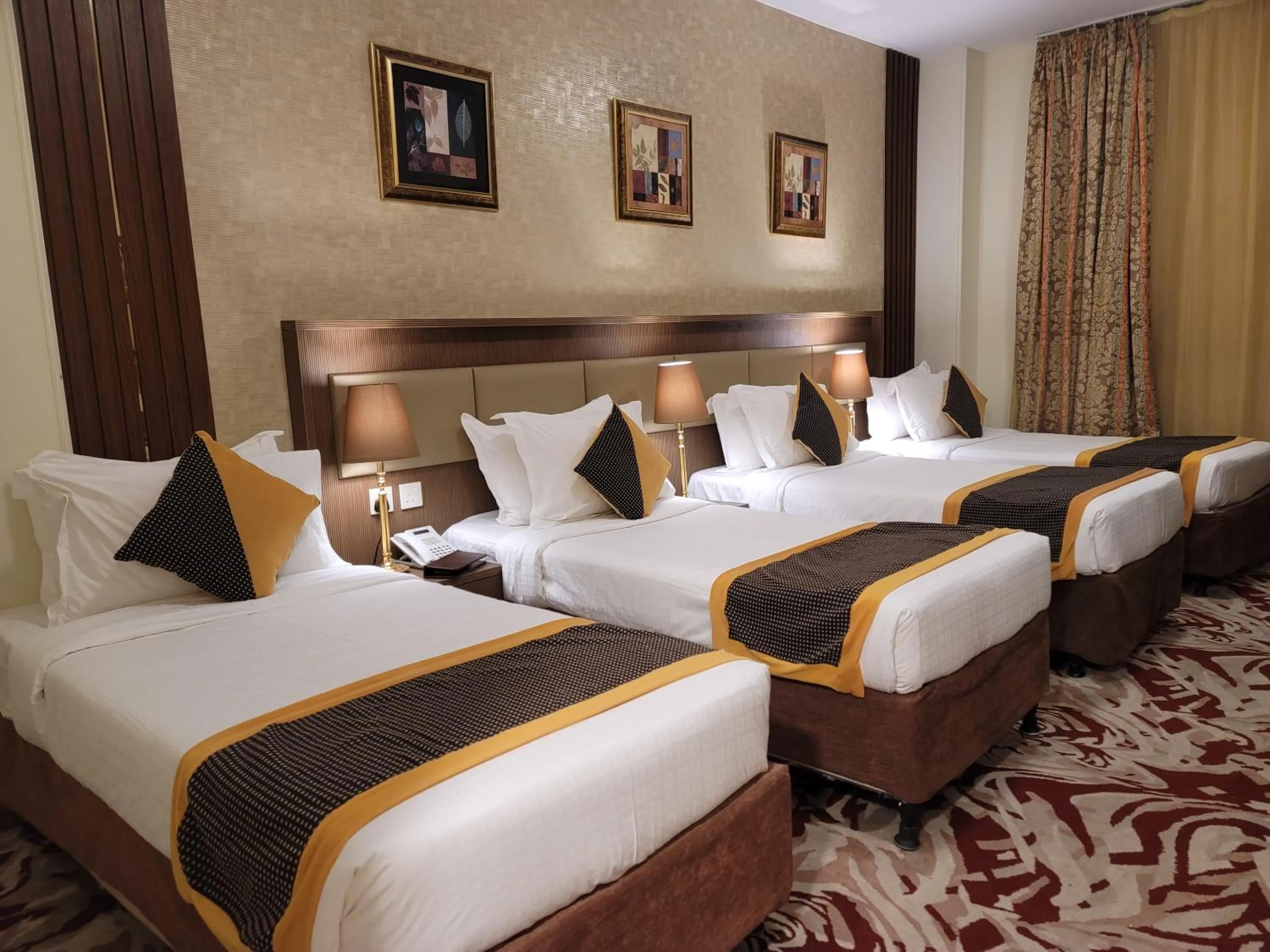 Bed in Al Ansar Palace Golden Tulip Hotel