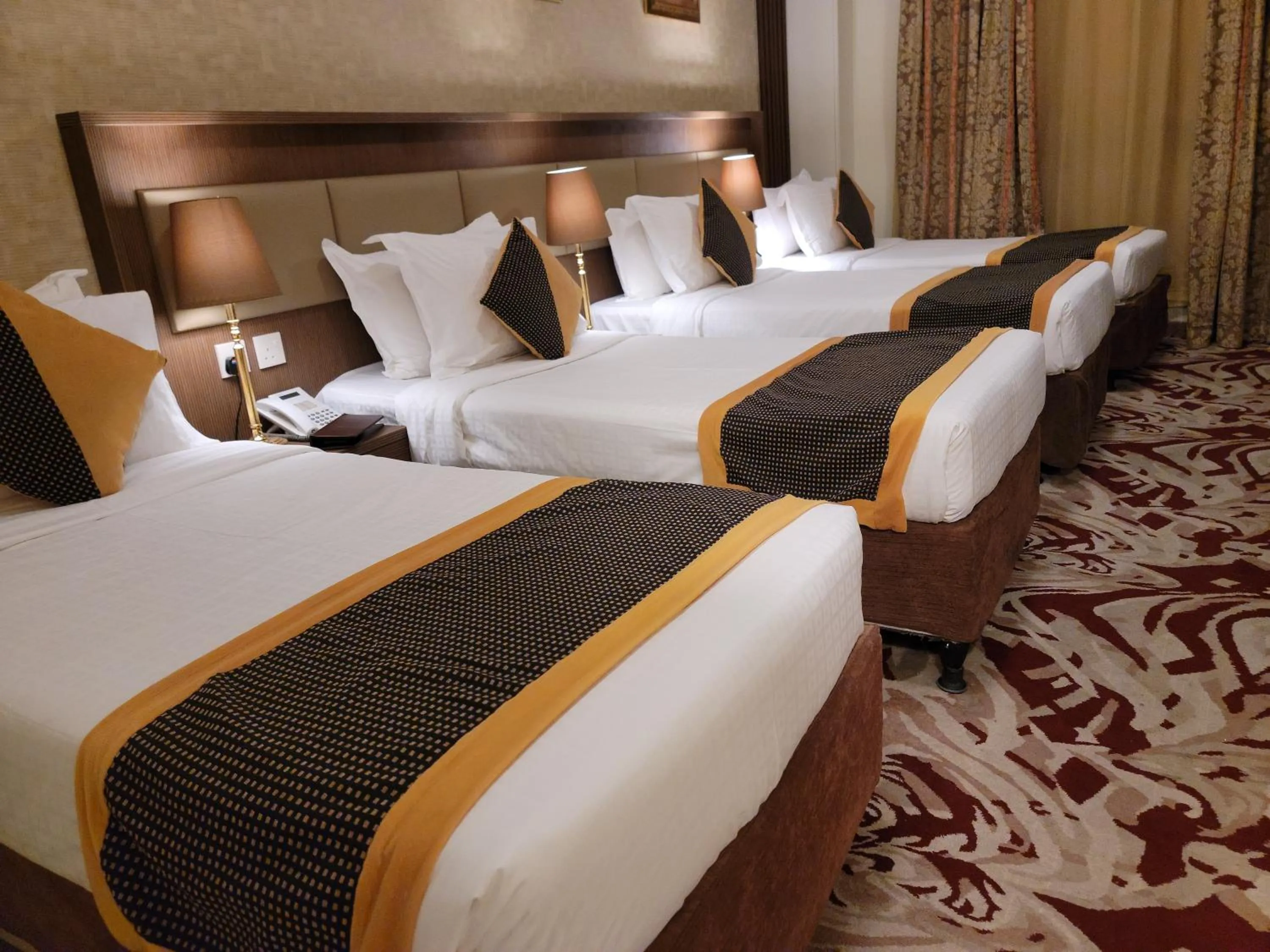Bed in Al Ansar Palace Golden Tulip Hotel