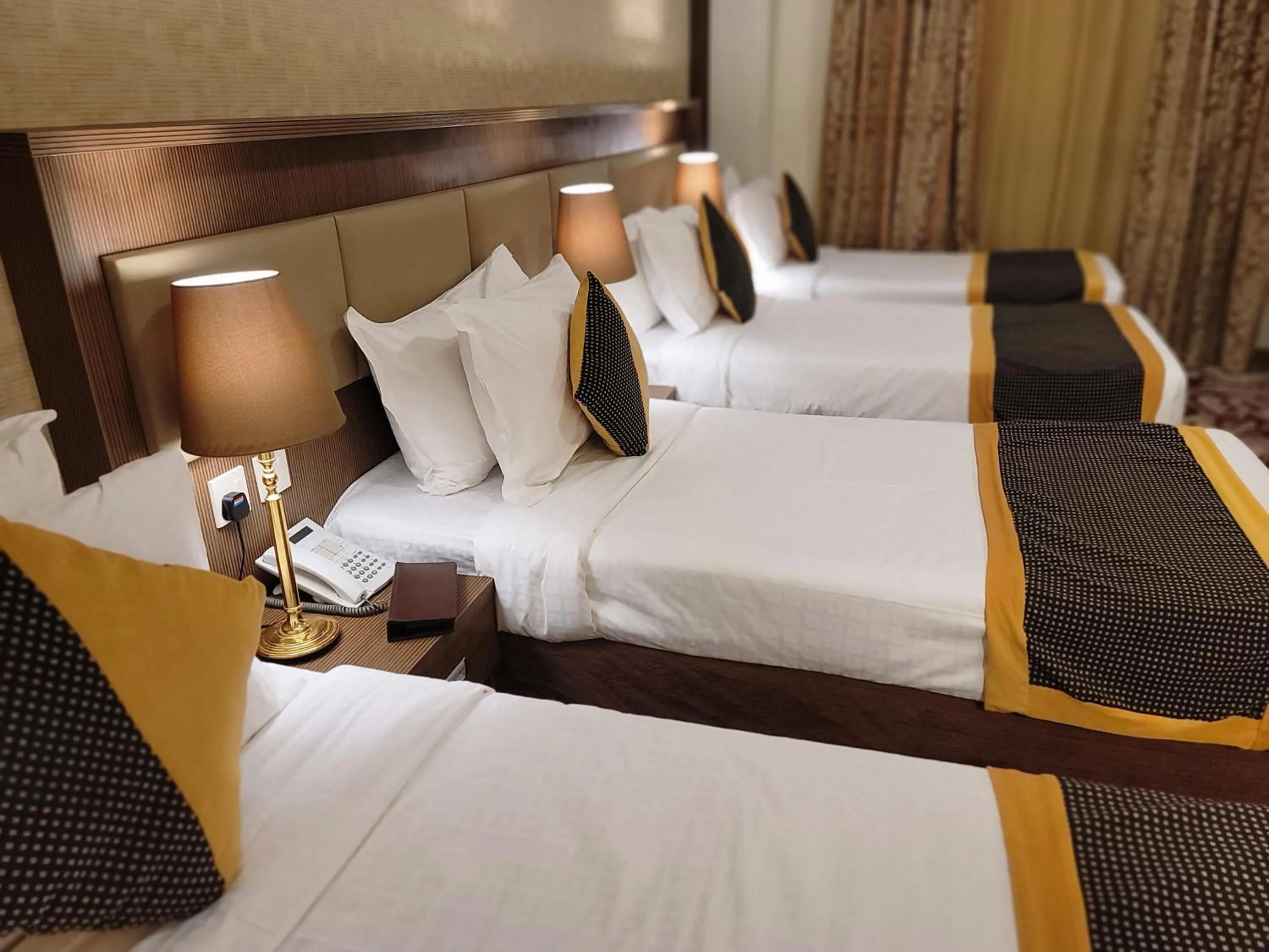 Bed in Al Ansar Palace Golden Tulip Hotel