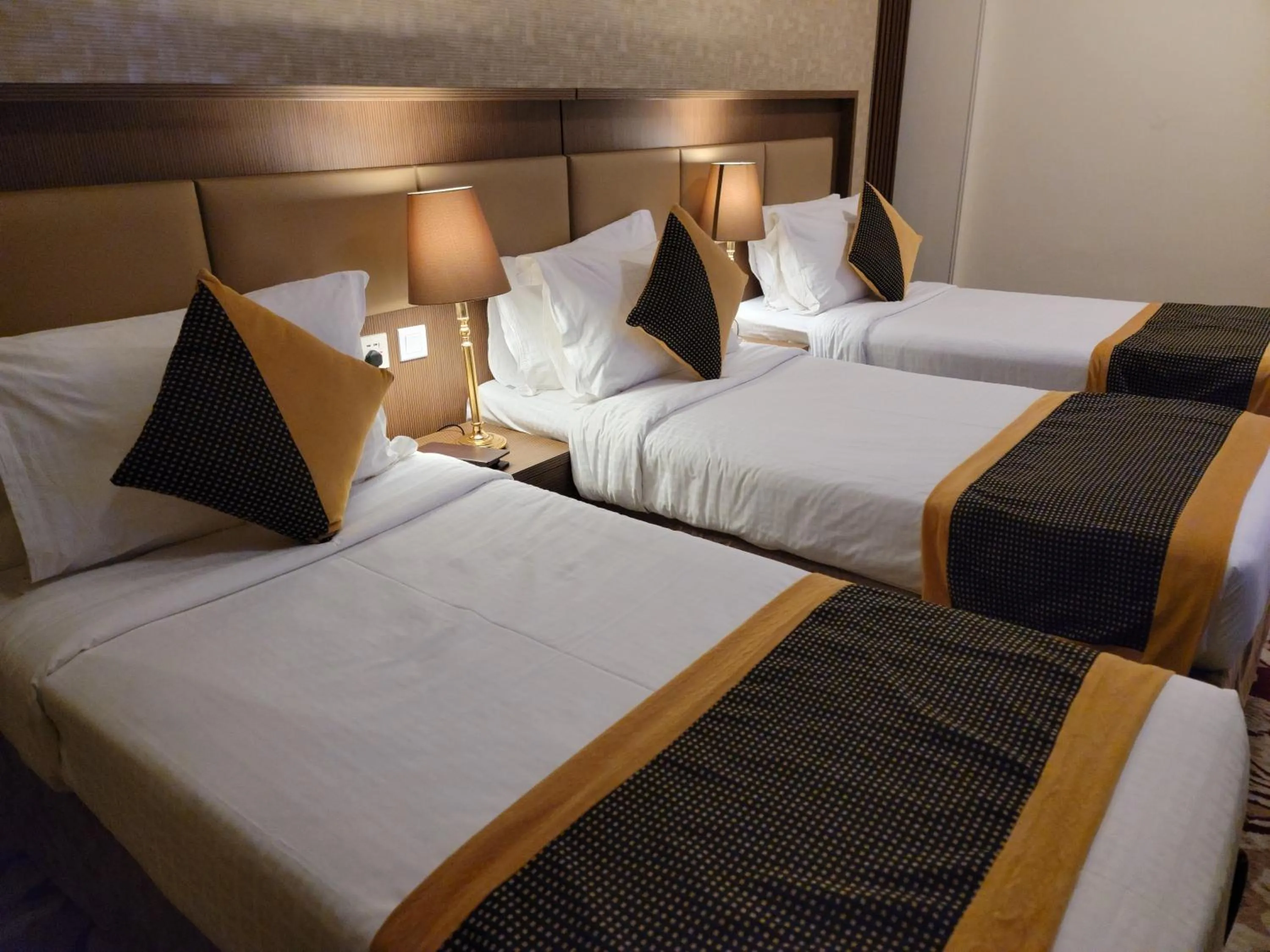 Bed in Al Ansar Palace Golden Tulip Hotel