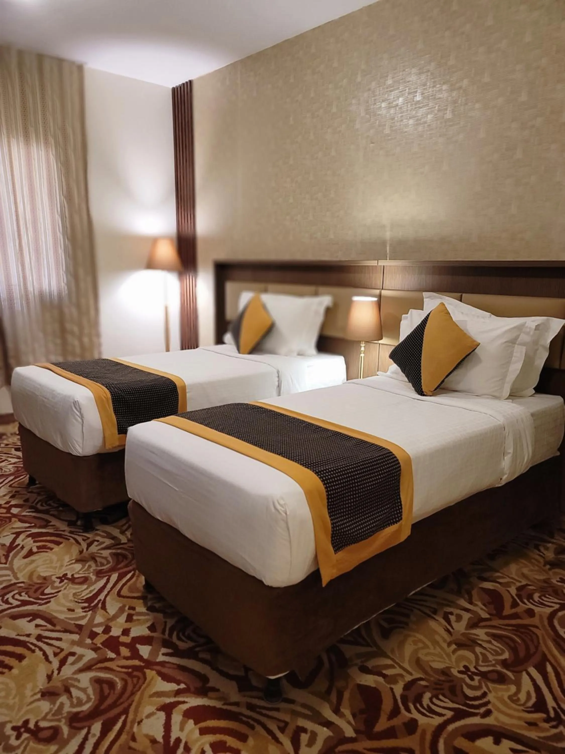 Bed in Al Ansar Palace Golden Tulip Hotel