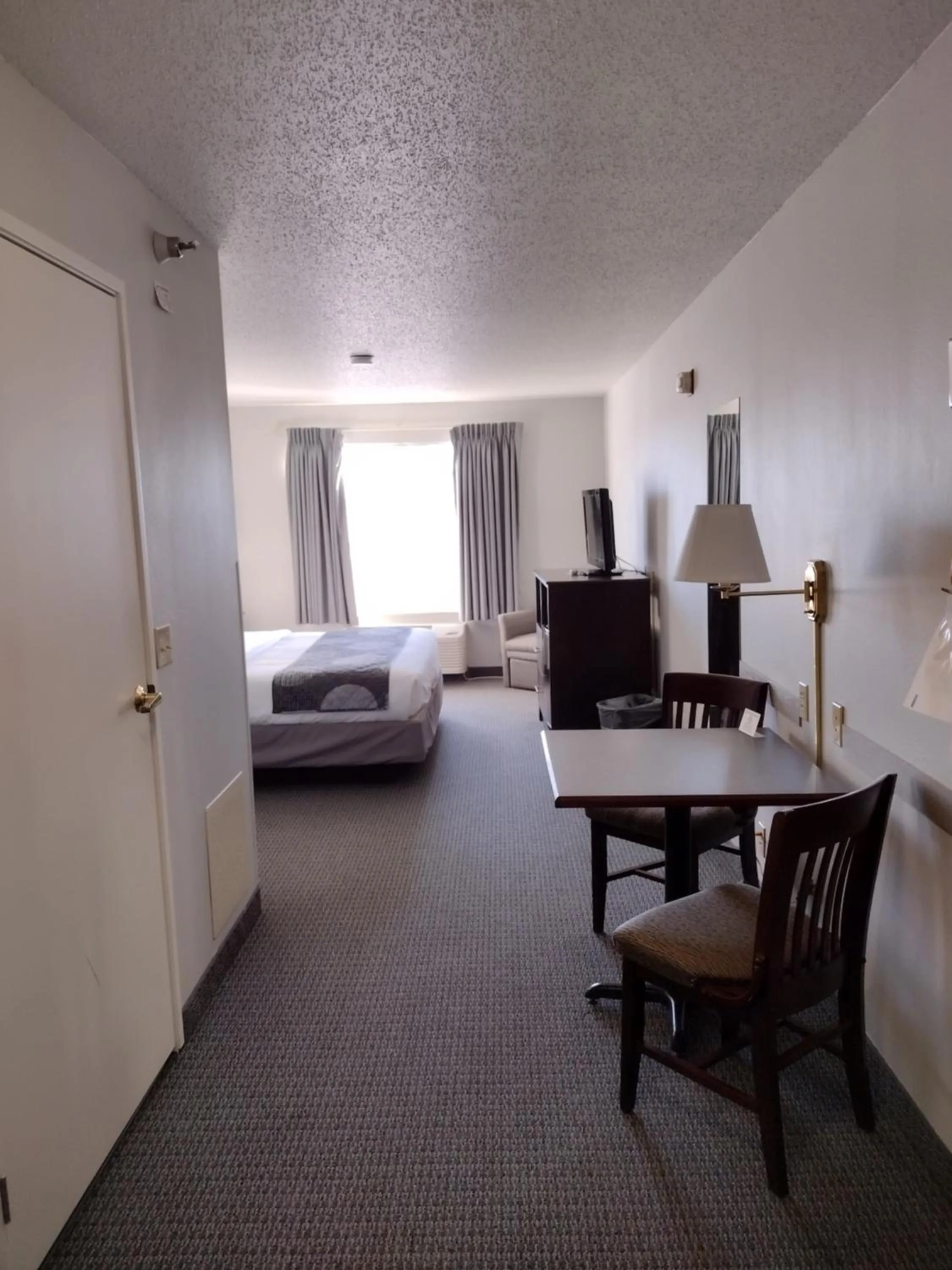 Bed in GrandStay Hotel & Suites Hastings