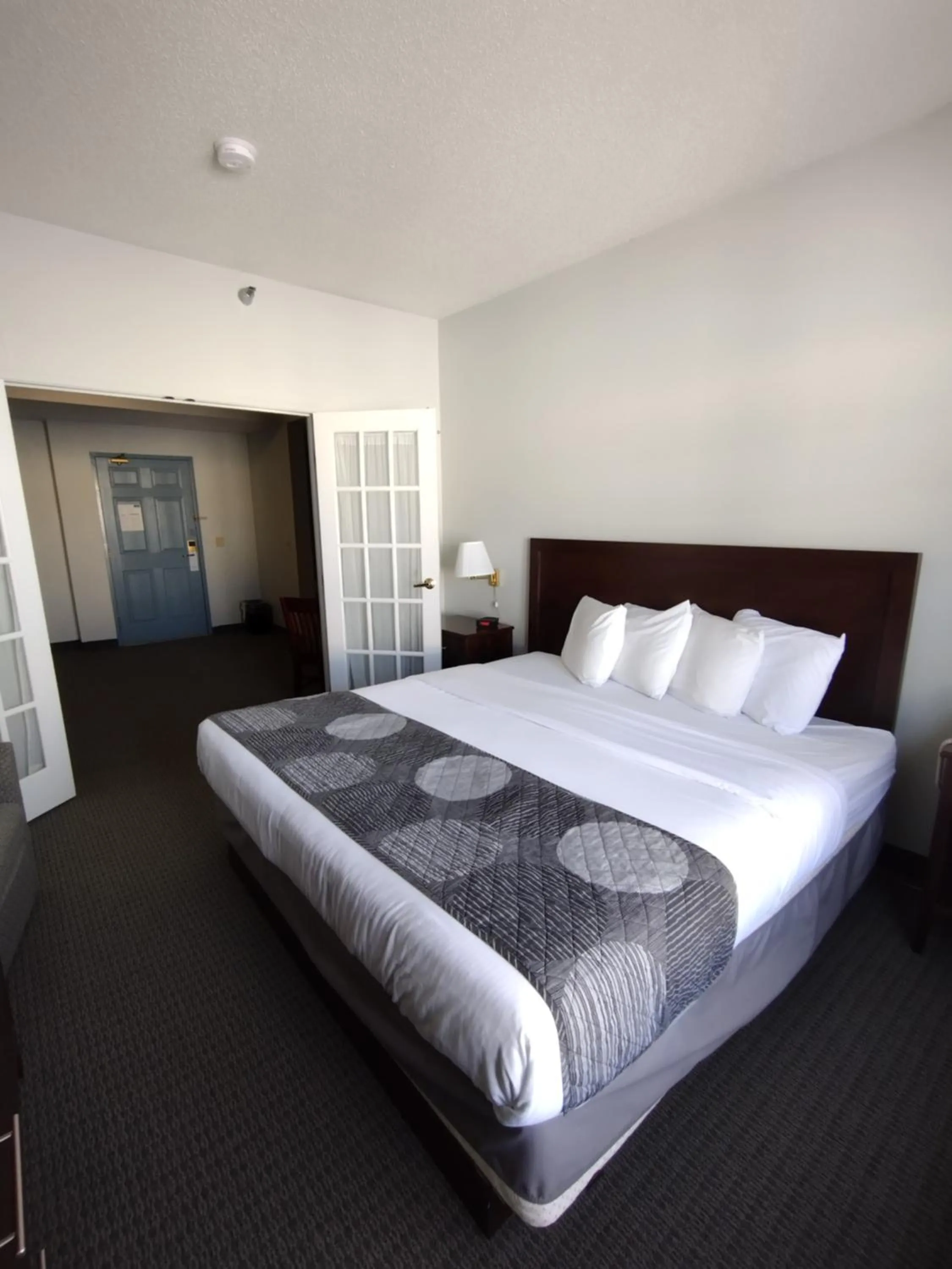 Bed in GrandStay Hotel & Suites Hastings