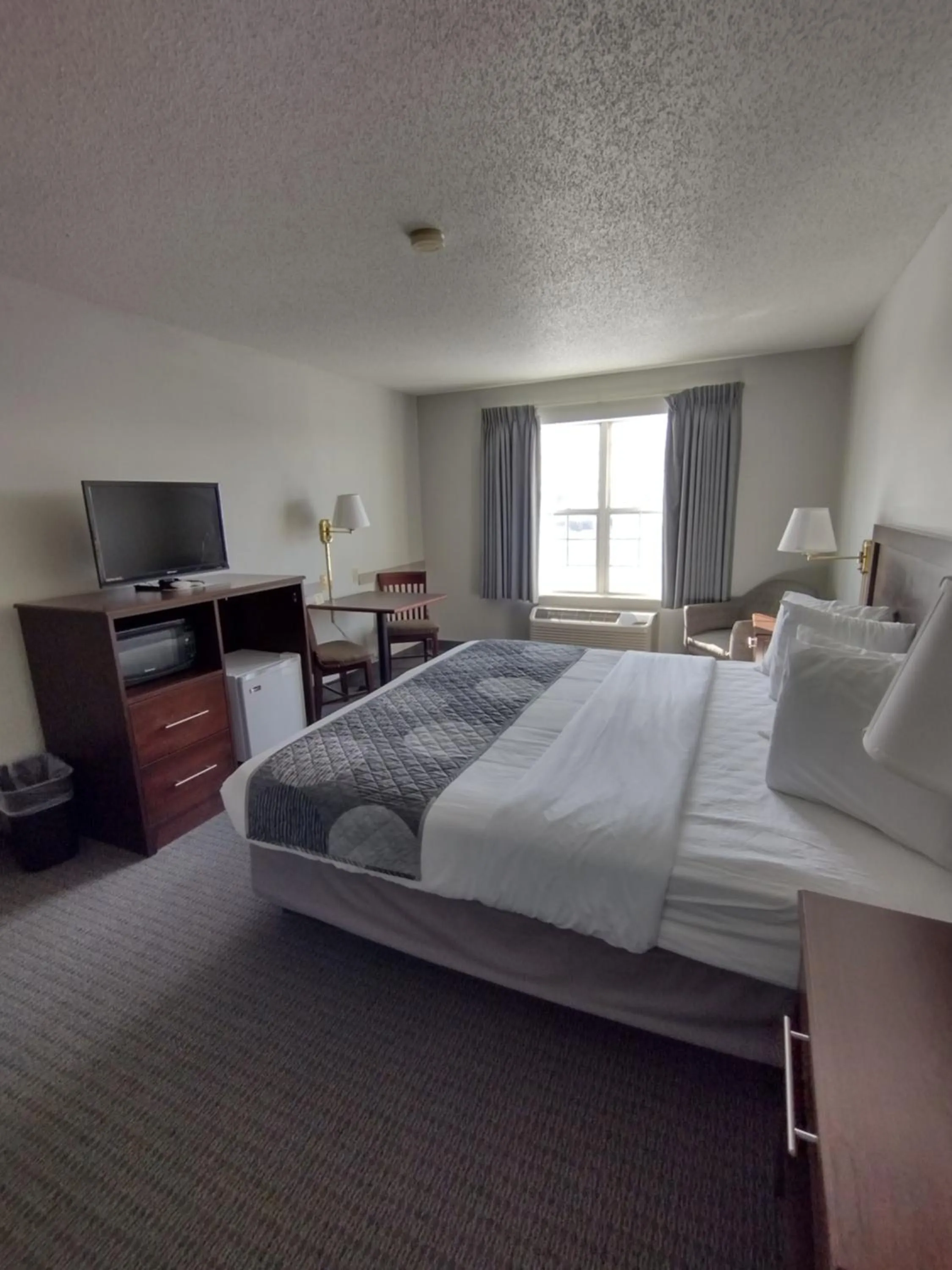 Bed in GrandStay Hotel & Suites Hastings